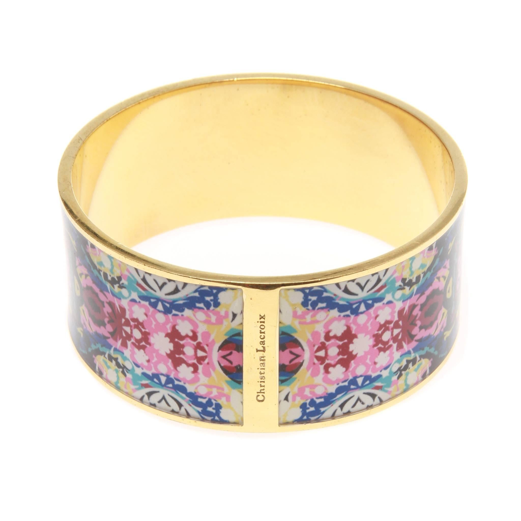 CHRISTIAN LACROIX ENAMEL GILDED BANGLE BRACELET

Intricately gilded bangle bracelet by CHRISTIAN LACROIX.
Immaculate black enamel features multi-coloured floral print set against a gold-tone metal base. 

Designer name imprinted at break in print to