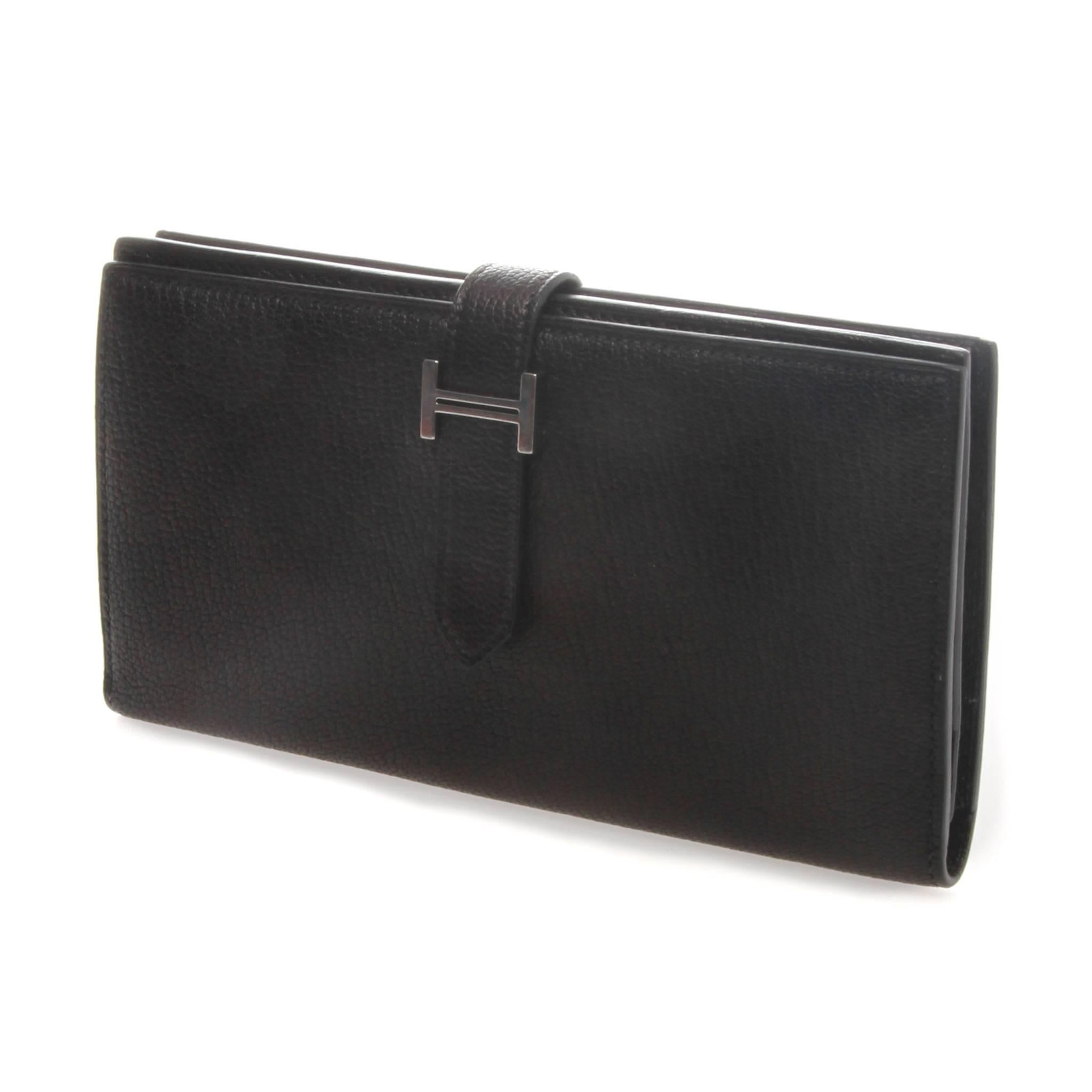 FINAL SALE - NO FURTHER DISCOUNT
Madam Virtue  Co

An exceptional Hermès Béarn Ladies Wallet.

A Soufflet wallet in black Epsom calfskin, silver palladium-plated H tab & leather strap closure, 
1 change purse with zipper, 5 credit card slots, 3