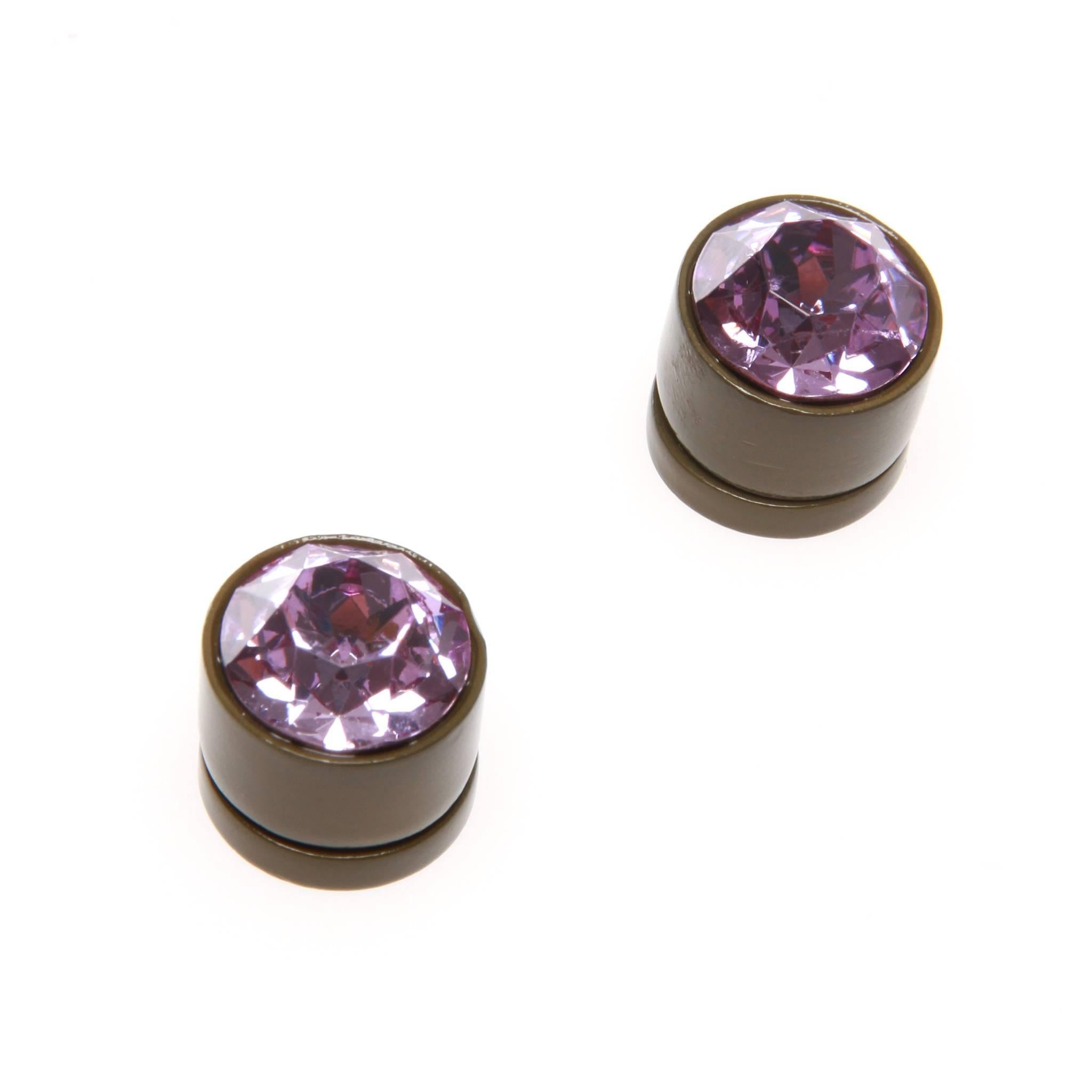 Givenchy magnetic closure earrings featuring a purple rhinestone set in an army green painted metal setting. 

Ricardo Tisci for Givenchy .Unisex. 