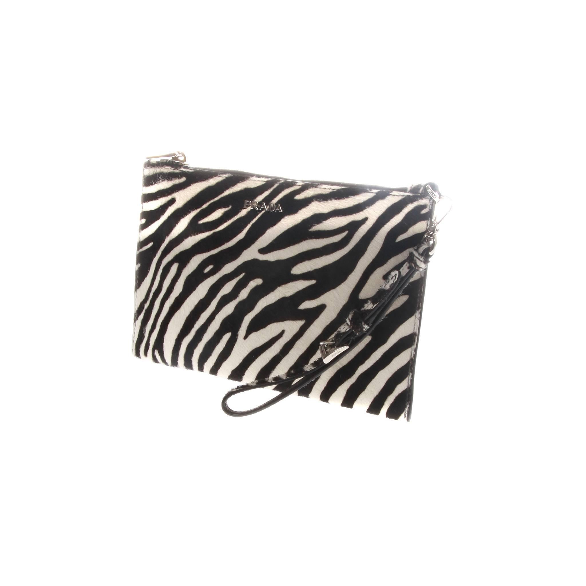 Prada zebra print pony hair pouch with silver-tone hardware and detachable wristlet strap. 