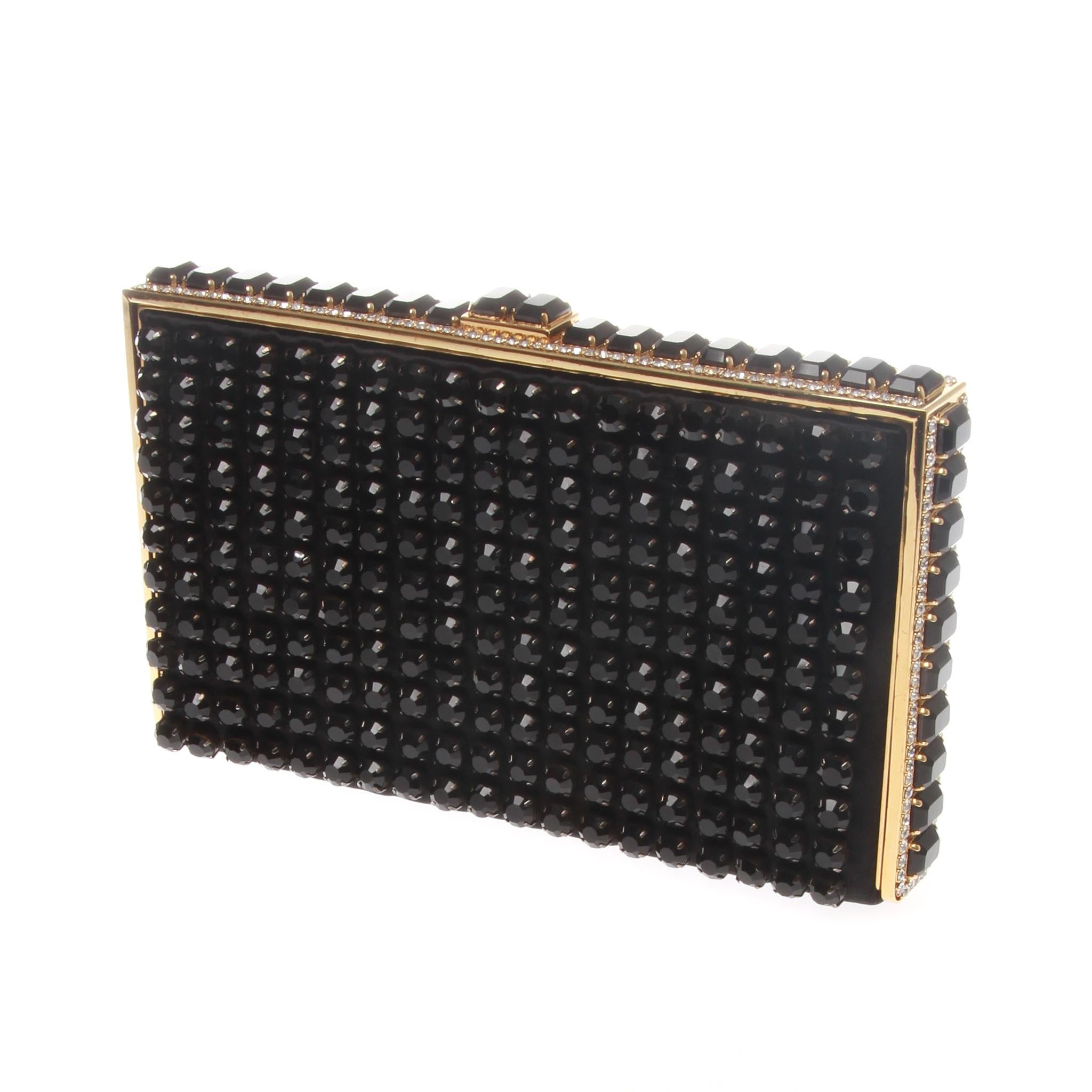 Valentino Garavani Black Beaded Crystal Evening Handbag Clutch
With this Stunning Valentino Garavani Evening Clutch on your hand you’ll be the belle of both ball and boardroom for its symphony of crystals glamour.
The glamorous and studded with