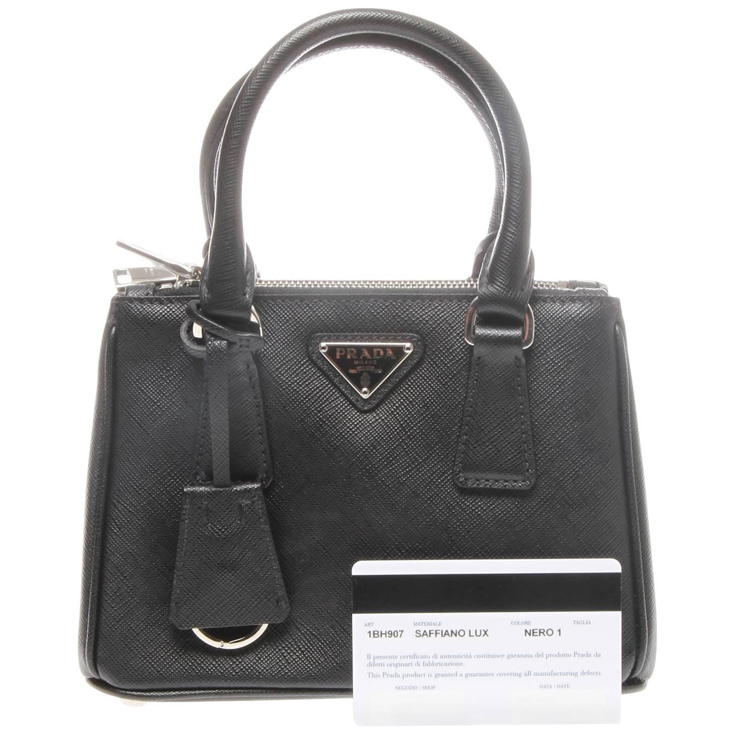 Prada Saffiano Lux Mini Promenade Bag

Beautifully structured in a dome silhouette, this petite satchel features luxe metallic Saffiano calf leather and an optional strap for wearing cross body.
It features double top handles, 2½