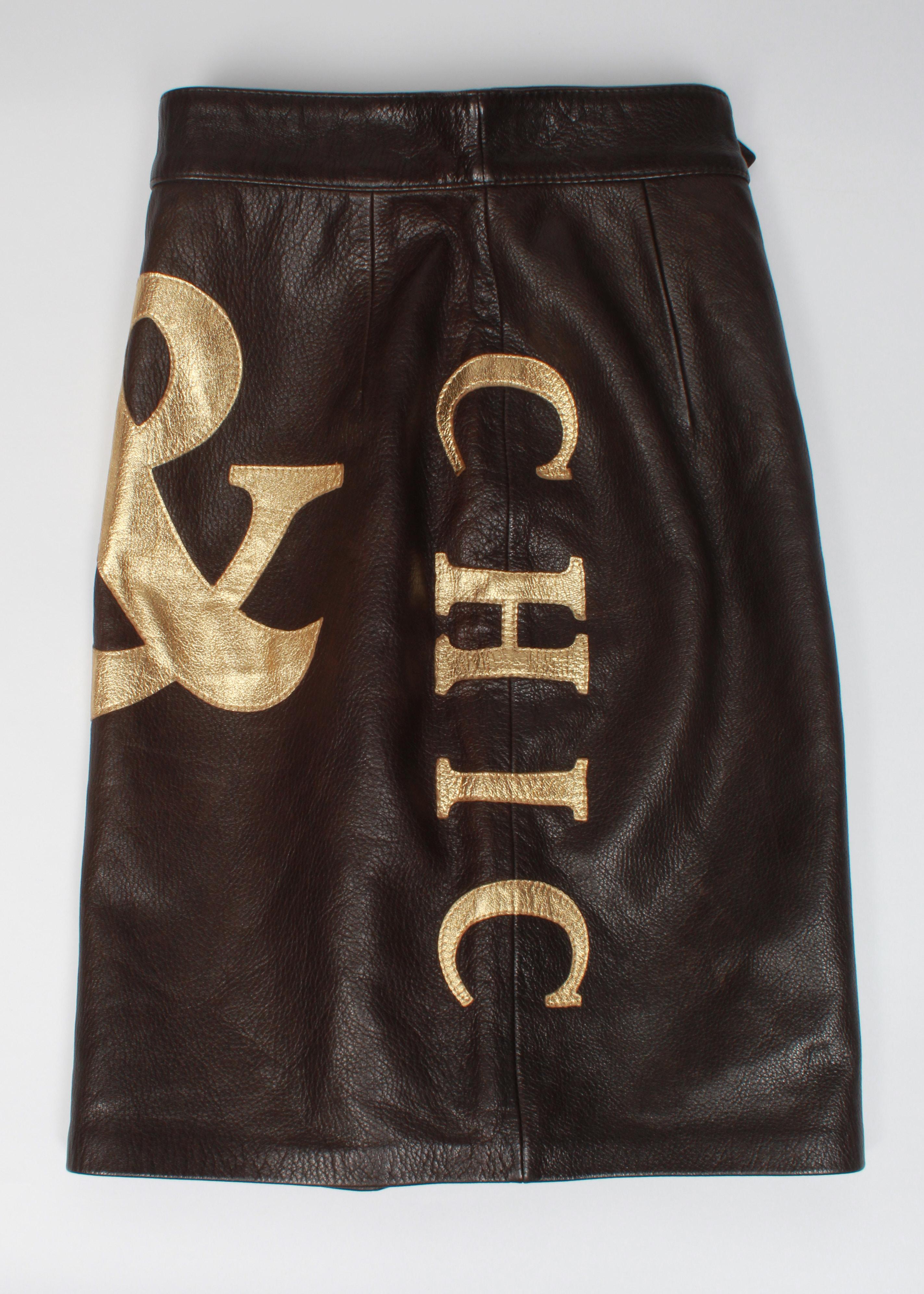 Iconic and collectable Moschino Cheap & Chic chocolate brown and gold leather skirt features 