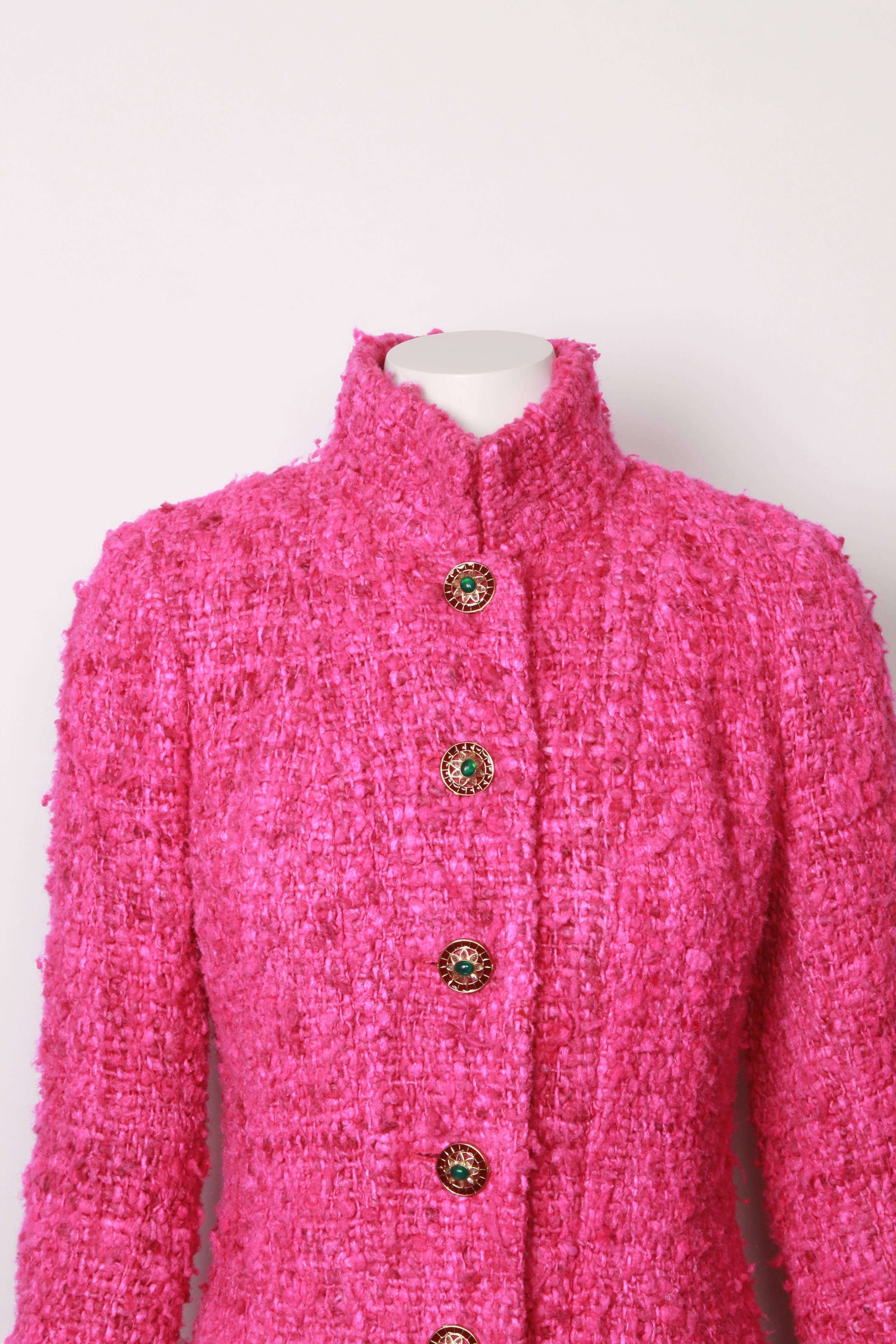 Rare collector's runway jacket in vivid pink boucle' Lesage tweed with jeweled buttons. From the Pre-Fall 2012 Maharaja Collection. Features detachable ivory and gold lurex cuffs.
Fully lined in custom Chanel camellia silk and golden chain detail