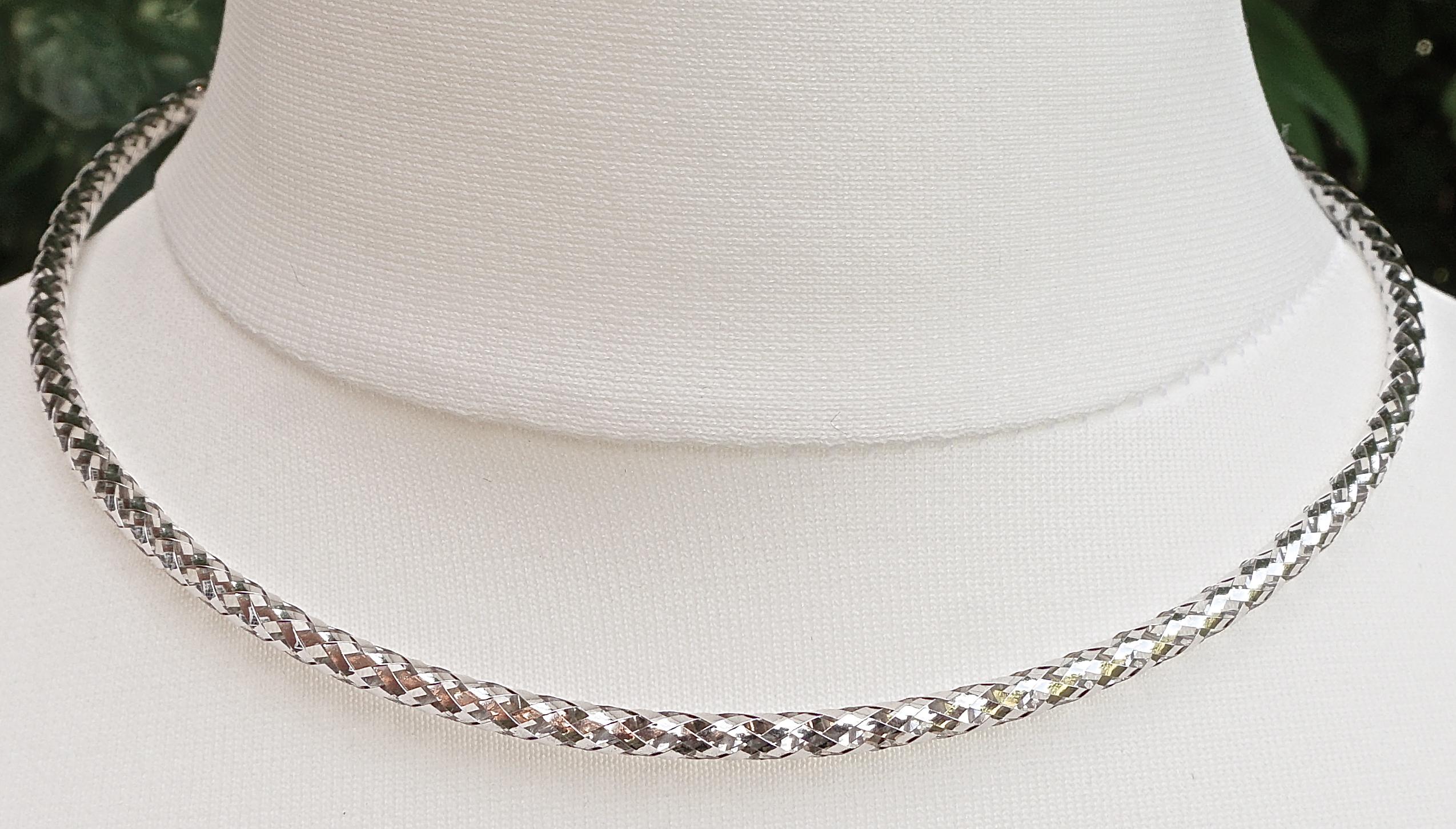 Milor 14K white gold round necklace stamped 14KT ITALY MILOR, featuring a lovely fancy criss-cross and diamond pattern. Length 42cm / 16.5 inches plus a 5cm / 2 inches extension, and the width is 3mm / .12 inch. The necklace is hollow and