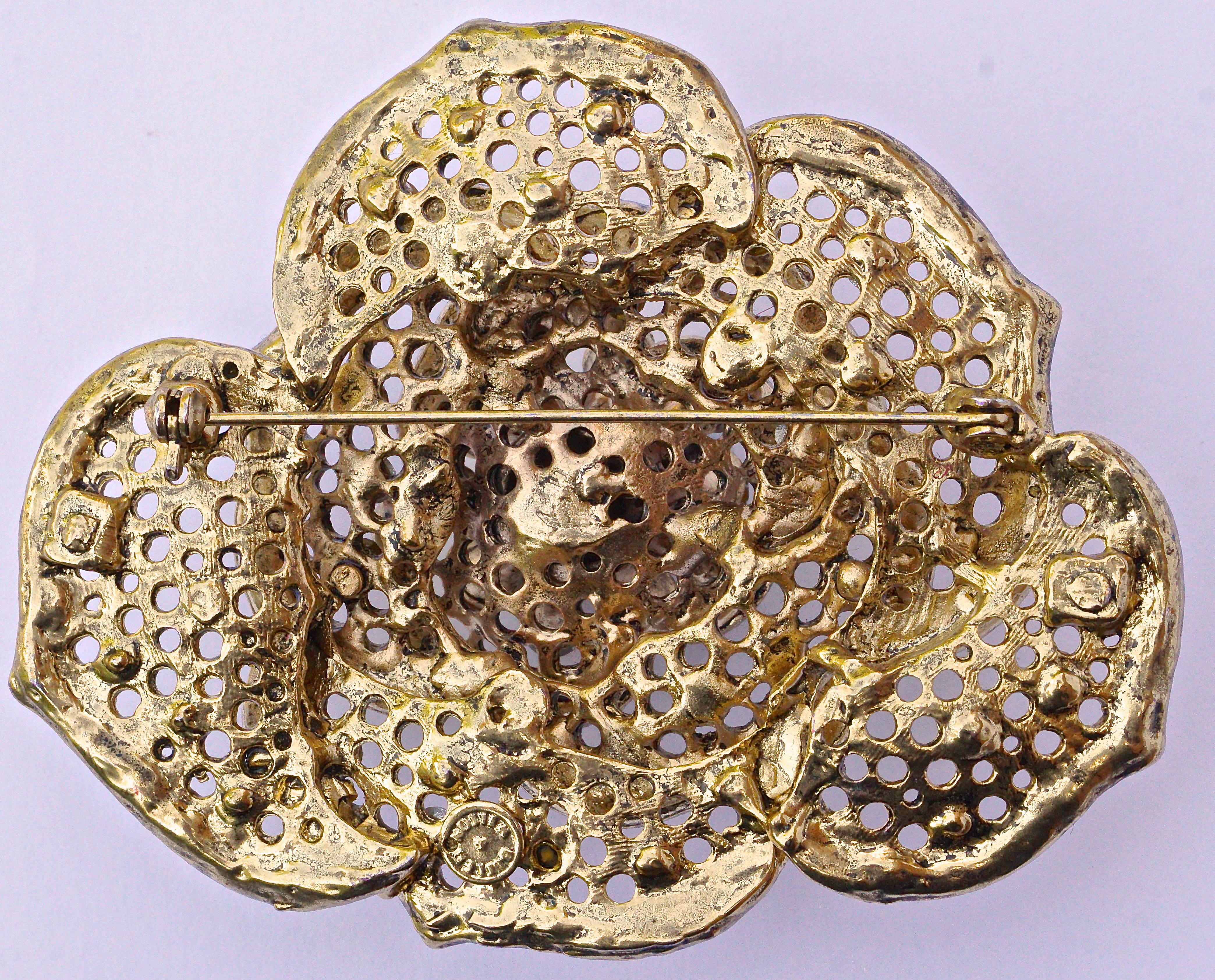 Butler & Wilson large gold plated flower brooch embellished with clear and aurora borealis crystals. The brooch is maximum 7.5cm (2.94 inches) wide, and 6cm (2.38 inches) tall.
 
This is a fabulous statement brooch with sparkling crystals, by London