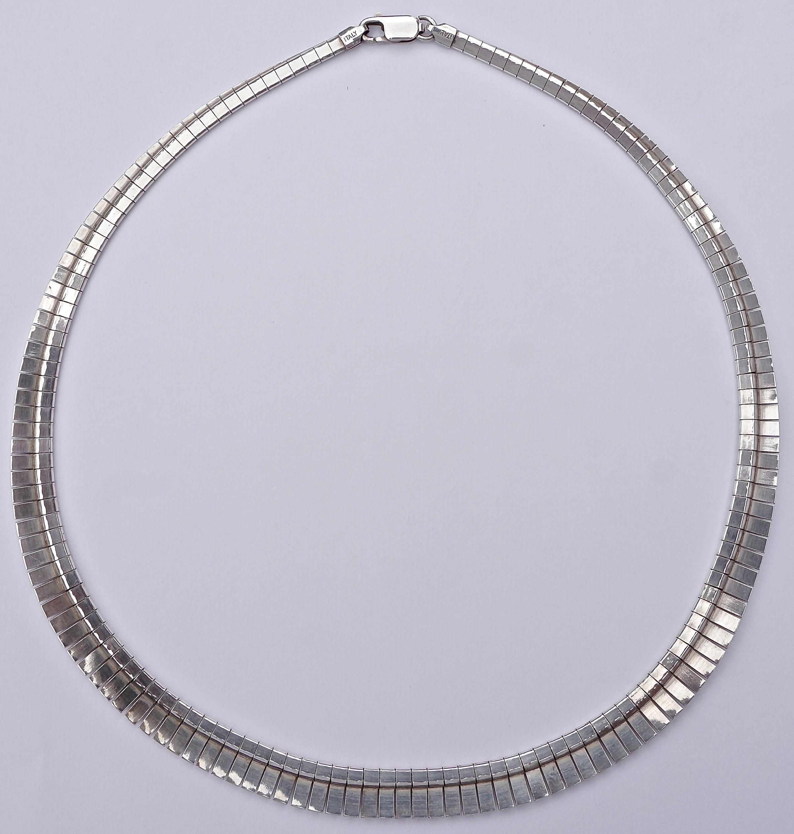 Egyptian style vintage sterling silver necklace featuring textured links with a lovely shiny geometric design, and edged in shiny silver. Length 45cm, 17.72 inches, the width graduates from 3mm, .12 inches at both ends, to 9mm, .35 inch, at the