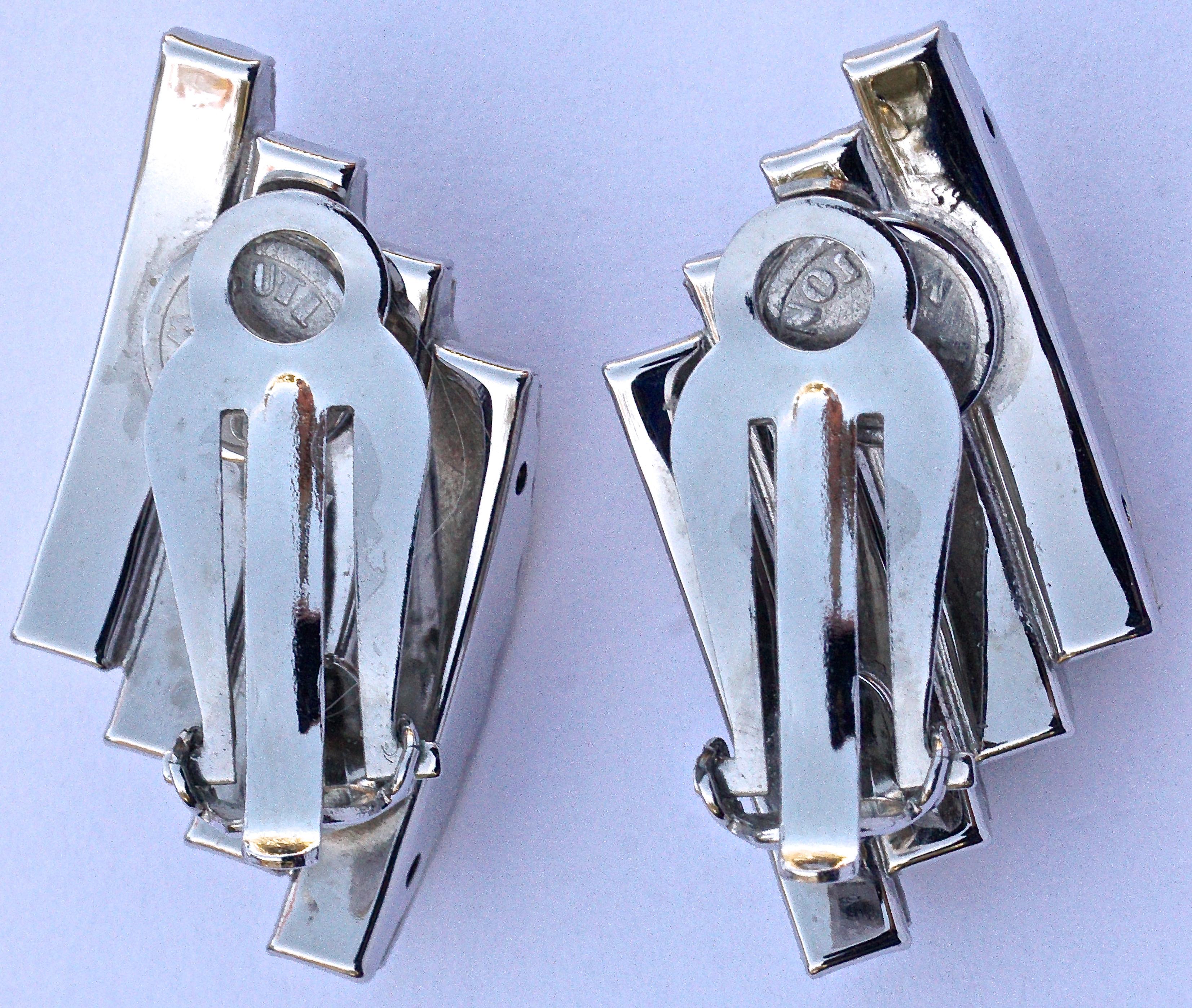 Stunning Butler and Wilson silver tone clip on earrings, featuring four rows of clear channel set crystals. The design is reminiscent of Art Deco 1930s jewellery made in Germany by companies such as Schreiber & Hiller. Measuring length 3.2cm / 1.25