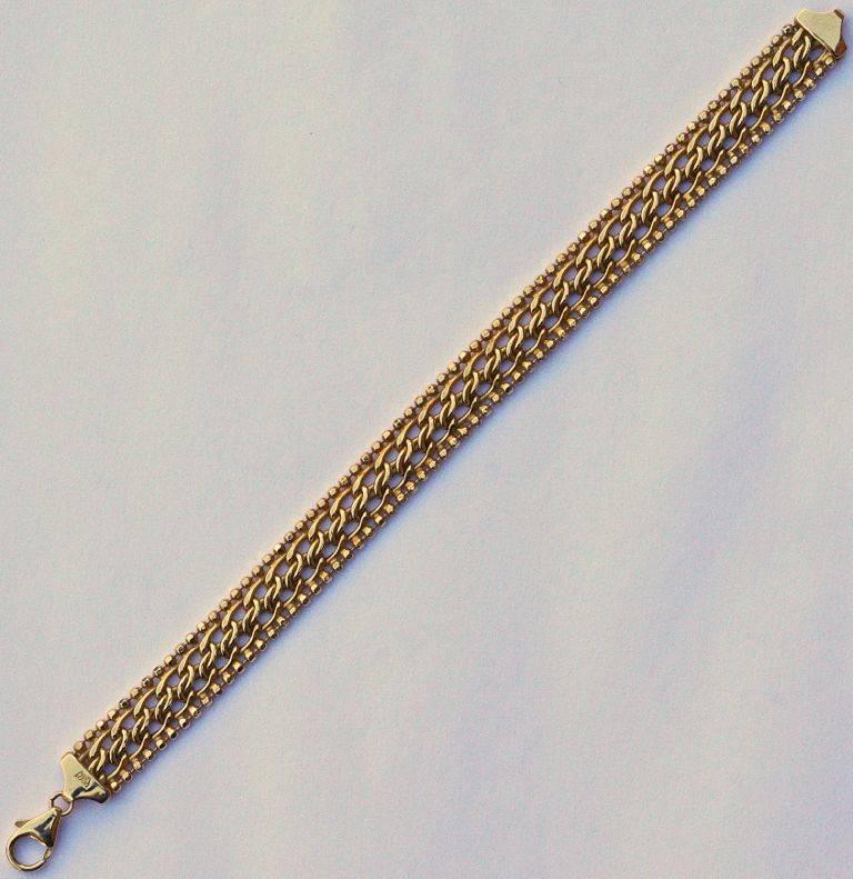 Milor 14K gold bracelet, featuring an intricate fancy link design edged with gold balls. Measuring length 18.5cm / 7.28 inches by width 1cm / .39 inches. 

This is a beautiful yellow gold bracelet by Italian company, Milor. Circa 1990s.