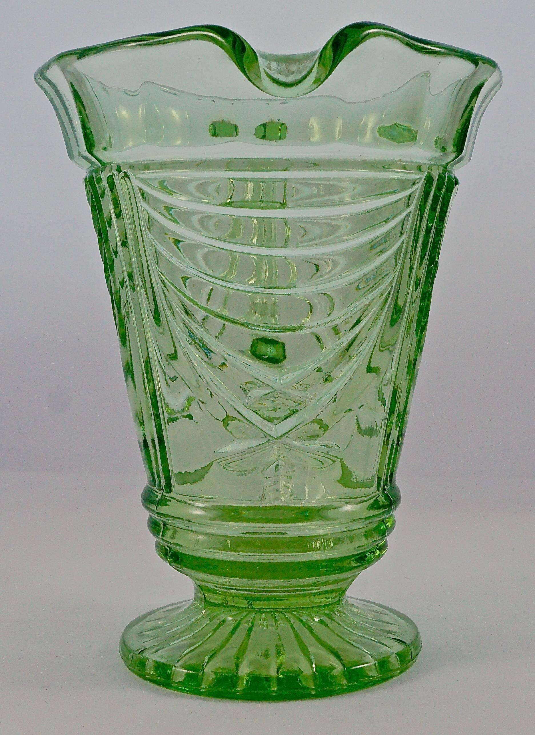 Sowerby green Art Deco jug made from pressed glass, in a swag and column design. Measuring height 17.8cm (7 inches) by maximum diameter 13.8cm (5.4 inches). There are some surface cracks and scratches. Overall, the jug is in very good