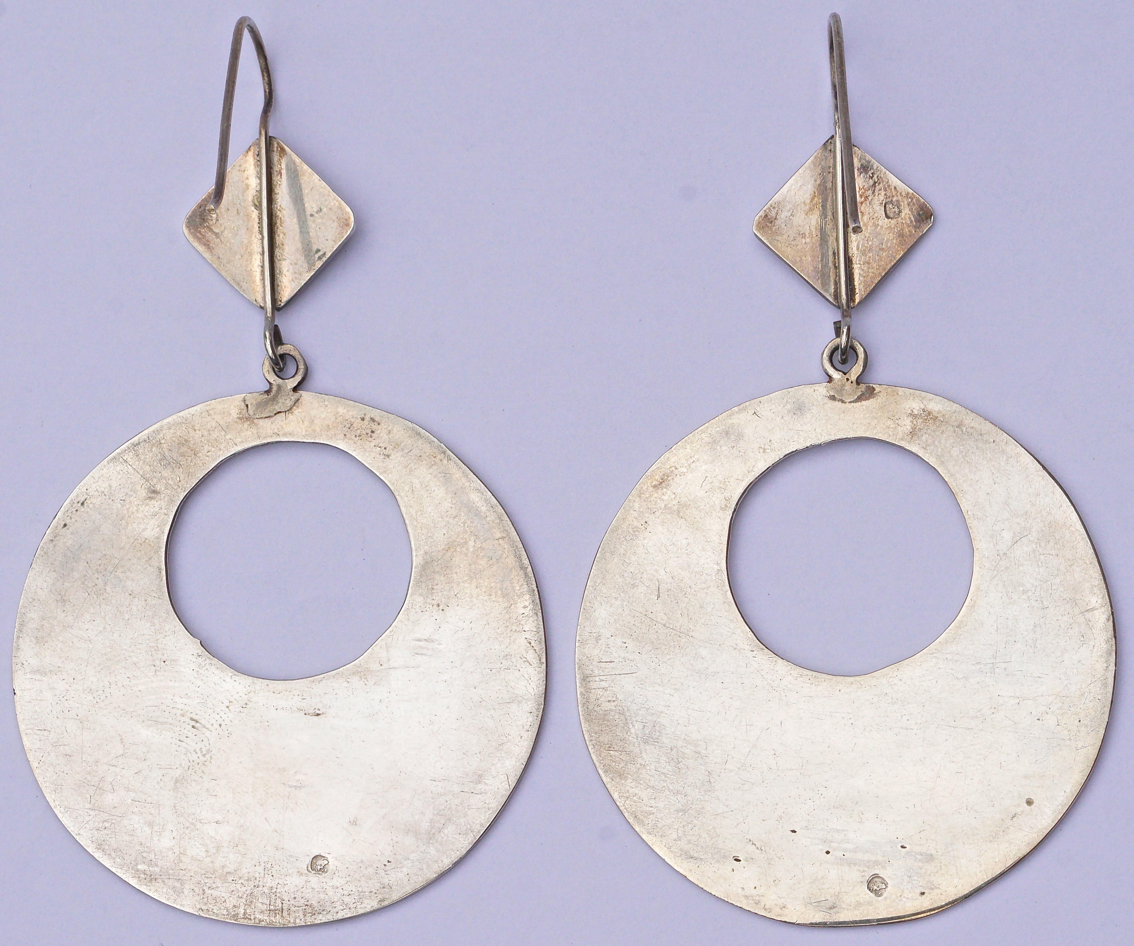 Fabulous pair of large silver etched Moroccan earrings, featuring a round cut out drop hoop, hanging from a diamond shape. They are handmade by Berbers, an ethnic people indigenous mainly to Morocco and Algeria.  The earrings hang a total of 8.2 cm