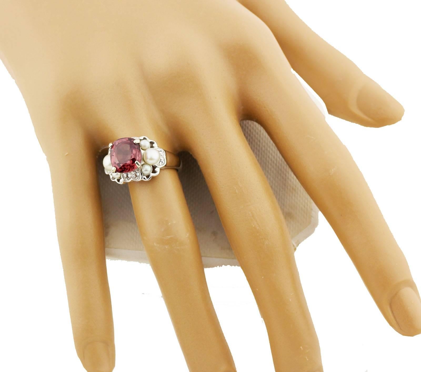 Set in Sterling Silver this sparkling red 3 Carat Zircon is enhanced with Pearls and teeny tiny little white Zircons.   The ring is a size 7 (sizable FOR FREE)    