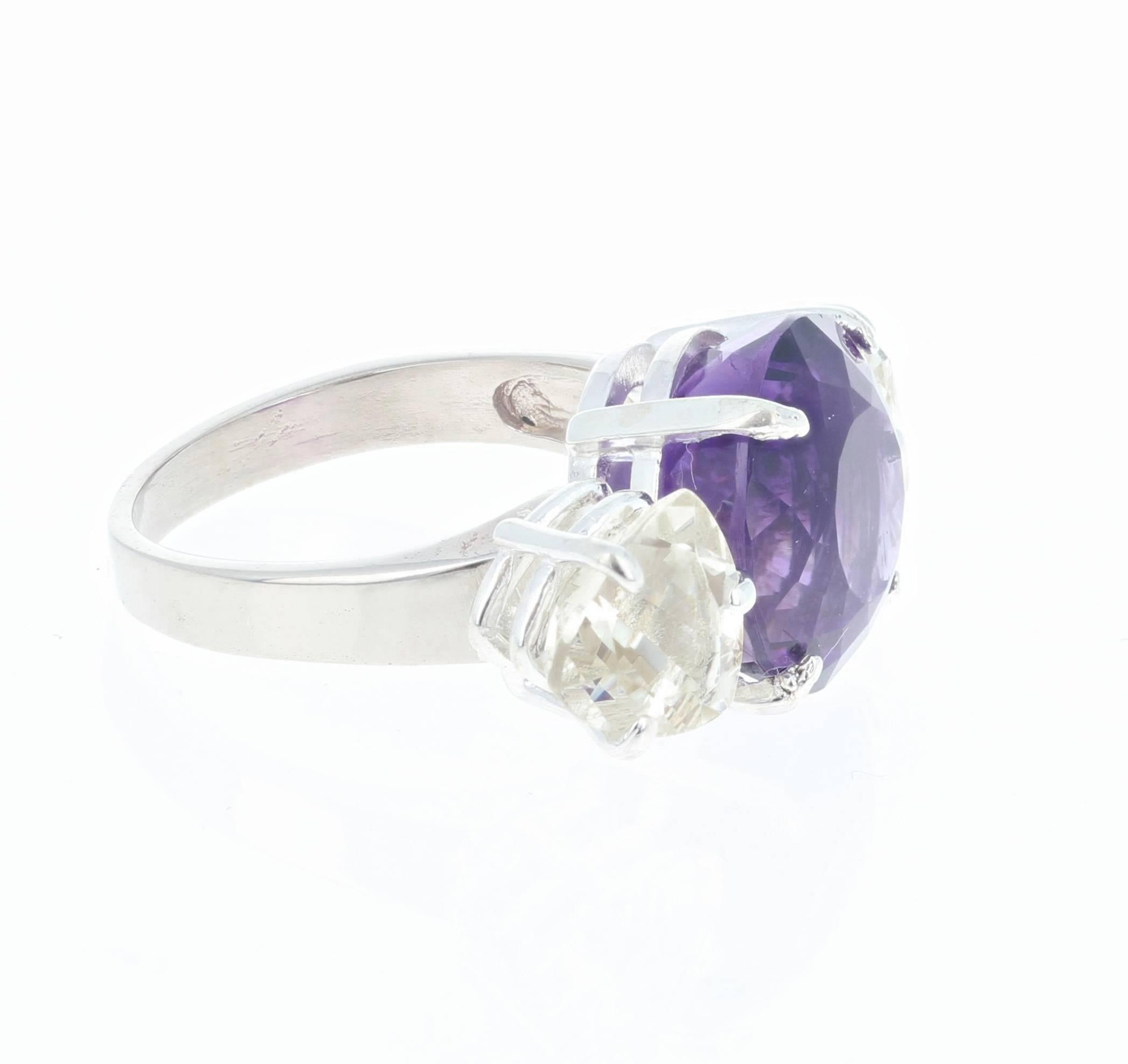 Sparkling African 9 carat round Amethyst (12.5 mm) enhanced with 6 carats of trillion cut Labradorite side stones set in a 6.75 size 14Kt white gold ring.
