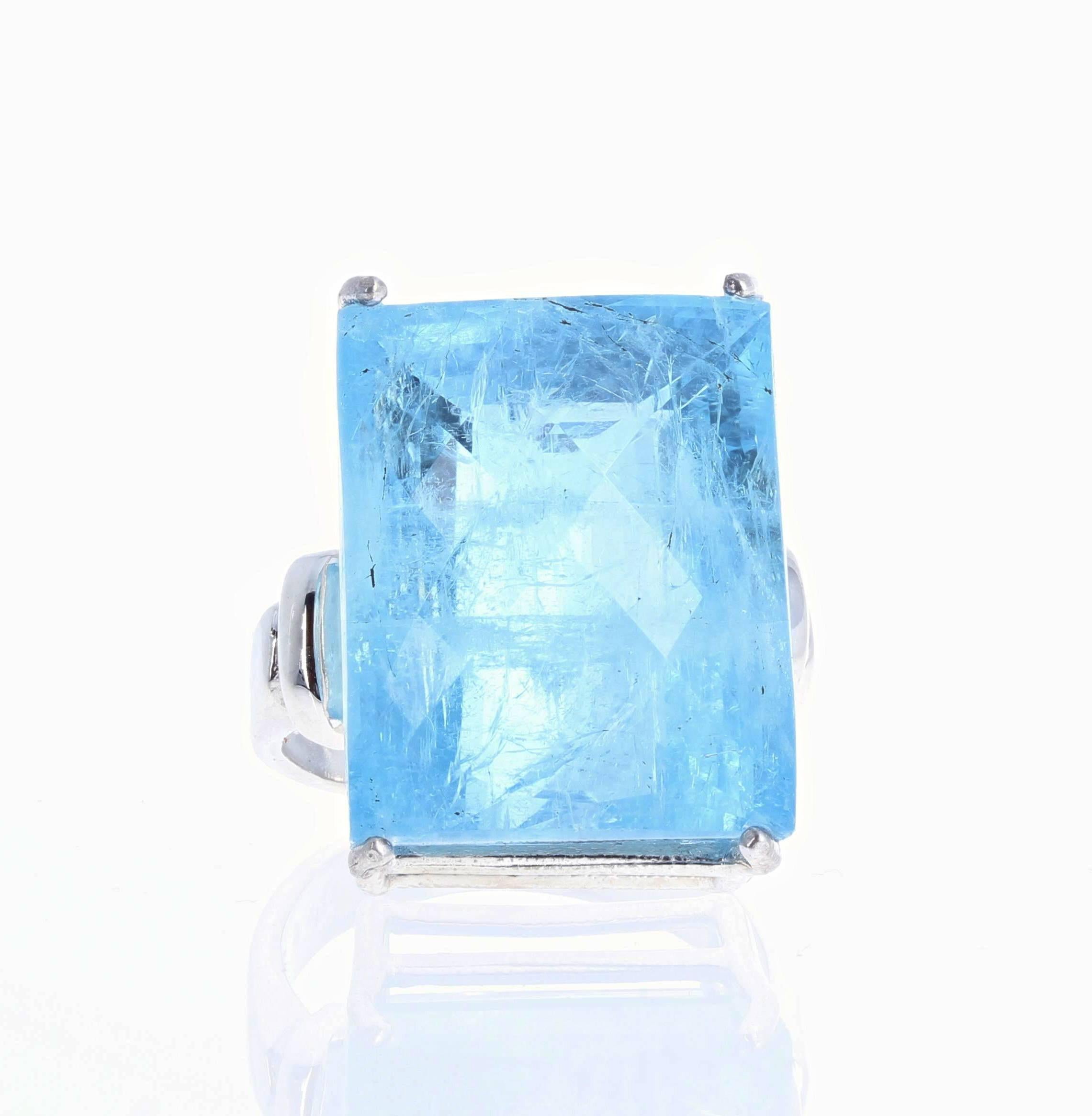 Huge glittering 43.4 carat blue natural Aquamarine gemstone (21.3 mm x 17.1 mm) set in a sterling silver ring size 9 (sizable).  Spectacular optical effects of the natural inclusions exhibits reflections and highlights in spectral blue colors.
