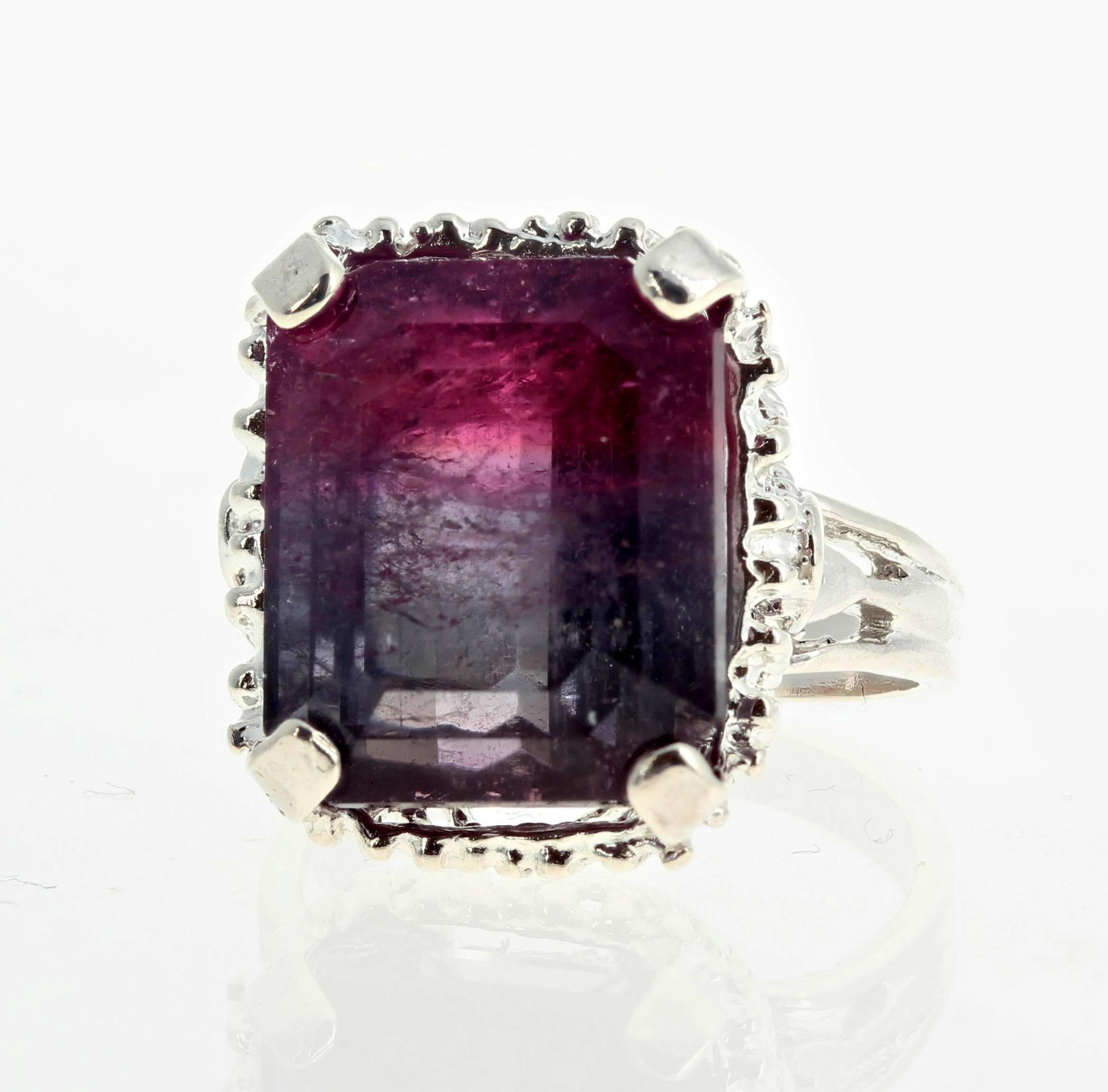 Large glowing 14.95 carat Bi-Color (purplish and red) emerald cut Tourmaline (12.7 mm x 14.9 mm) set in a sterling silver ring size 7 (sizable).    More from this seller by putting gemjunky into 1stdibs search bar.