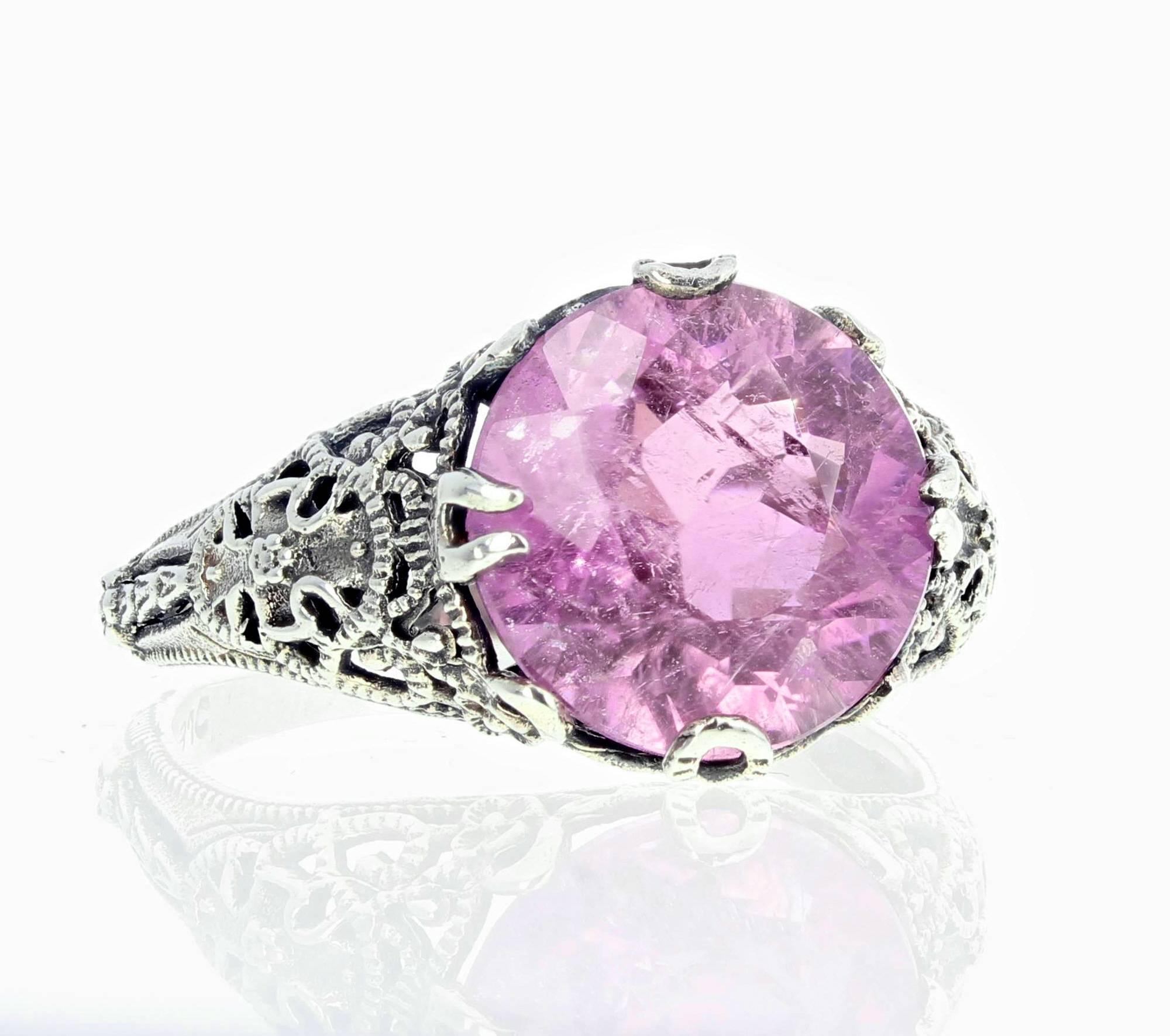 Pinky brilliant round 6.5 carat Kunzite (12 mm) set in a sterling silver ring size 9 (sizable FOR FREE).  Spectacular optical effect in the Kuzite exhibits pink reflections and fire highlights in pinky colors.   