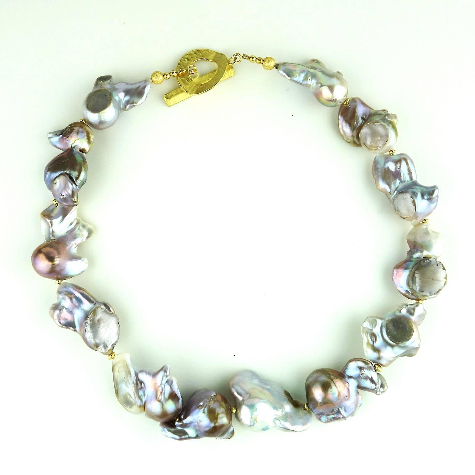 Gorgeous, large, silver Baroque Pearl necklace. These Baroque Pearls are unique in color and shape, each is a gem on its own. They iridesce in shades of pink, green and a touch of bronze.  The largest pearl measures 32x26MM.  The necklace measures