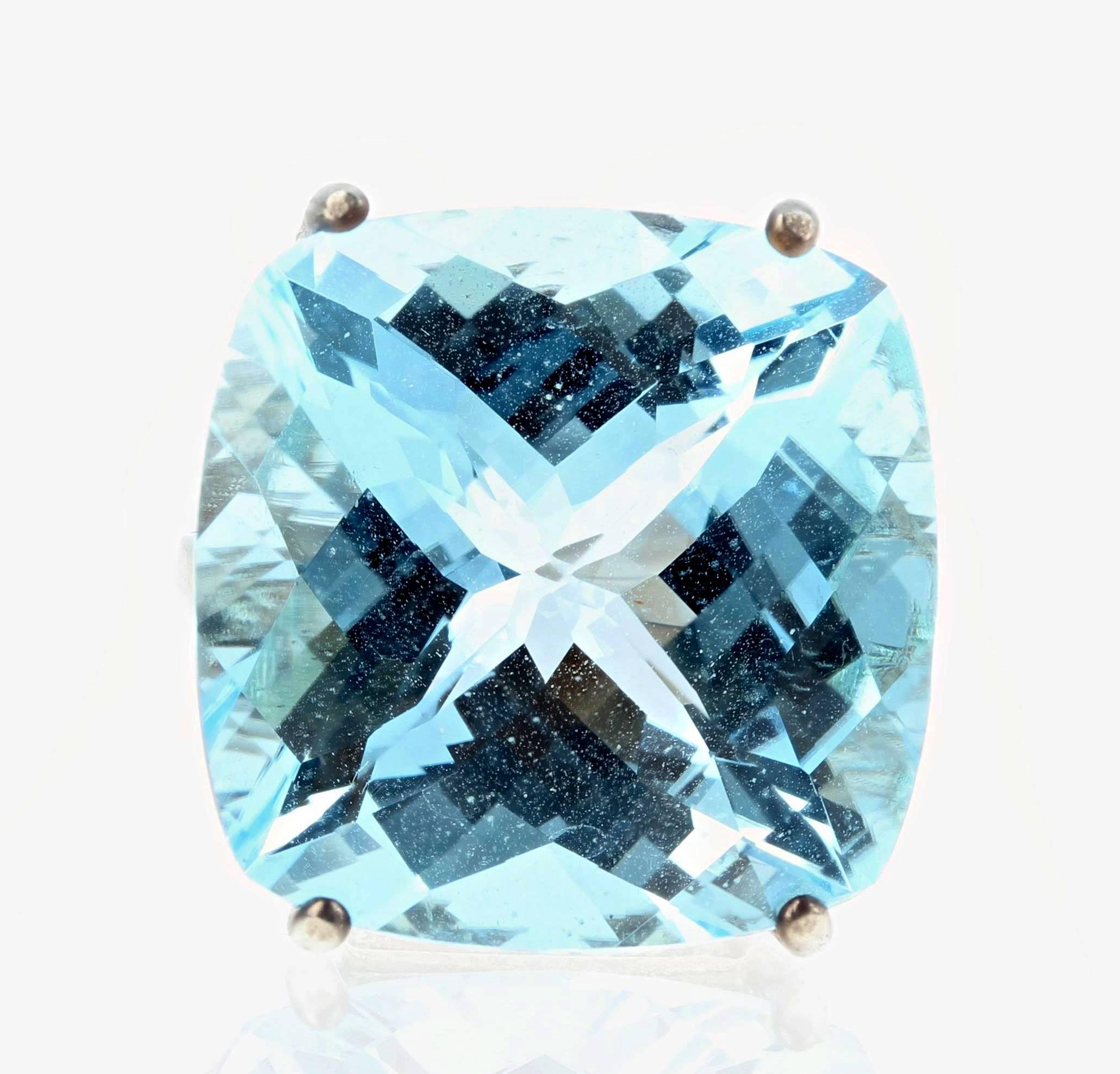 Glittering magnificent huge 37.86 carat blue Topaz (20 mm x 20 mm) set in a sterling silver ring size 7 (sizable) and comes with two bright blue Topaz sterling silver 10 mm round stud earrings as a gift from us to the purchaser of the ring..  There