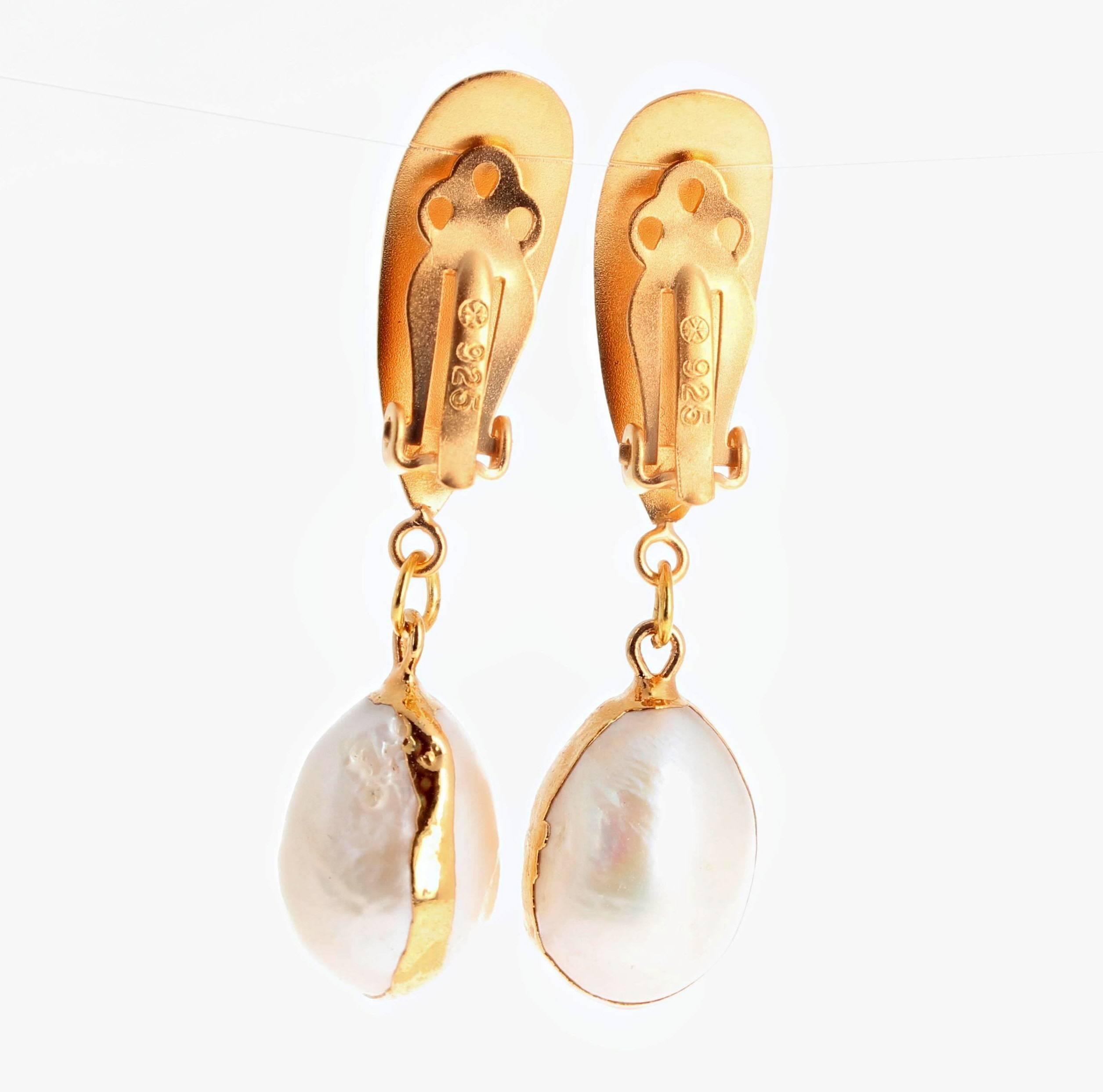 Gold Plated(Vermeil) clip-on earrings elegantly dangle white Pearls that hang approximately 1.7 inches from top of clip-on to bottom of Pearl.  