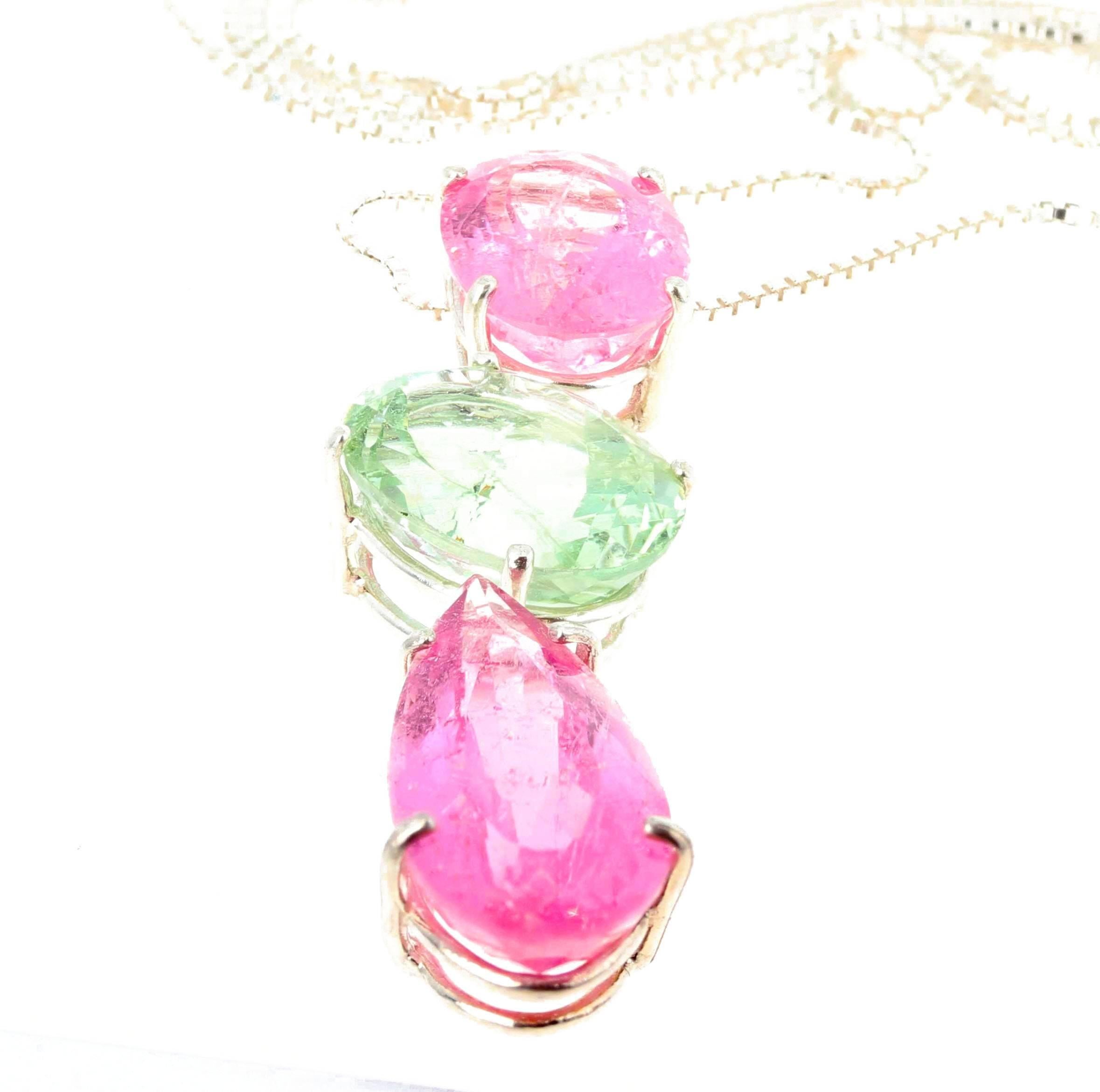22 carats of light pink and light green Tourmaline swing elegantly set in a three part sterling silver pendant.  (top pink 12.9 mm x 10 mm - green 14/4 mm x 10.7 mm - lower pink 20 mm x 10.1 mm).  Spectacular optical effect in the Tourmalines