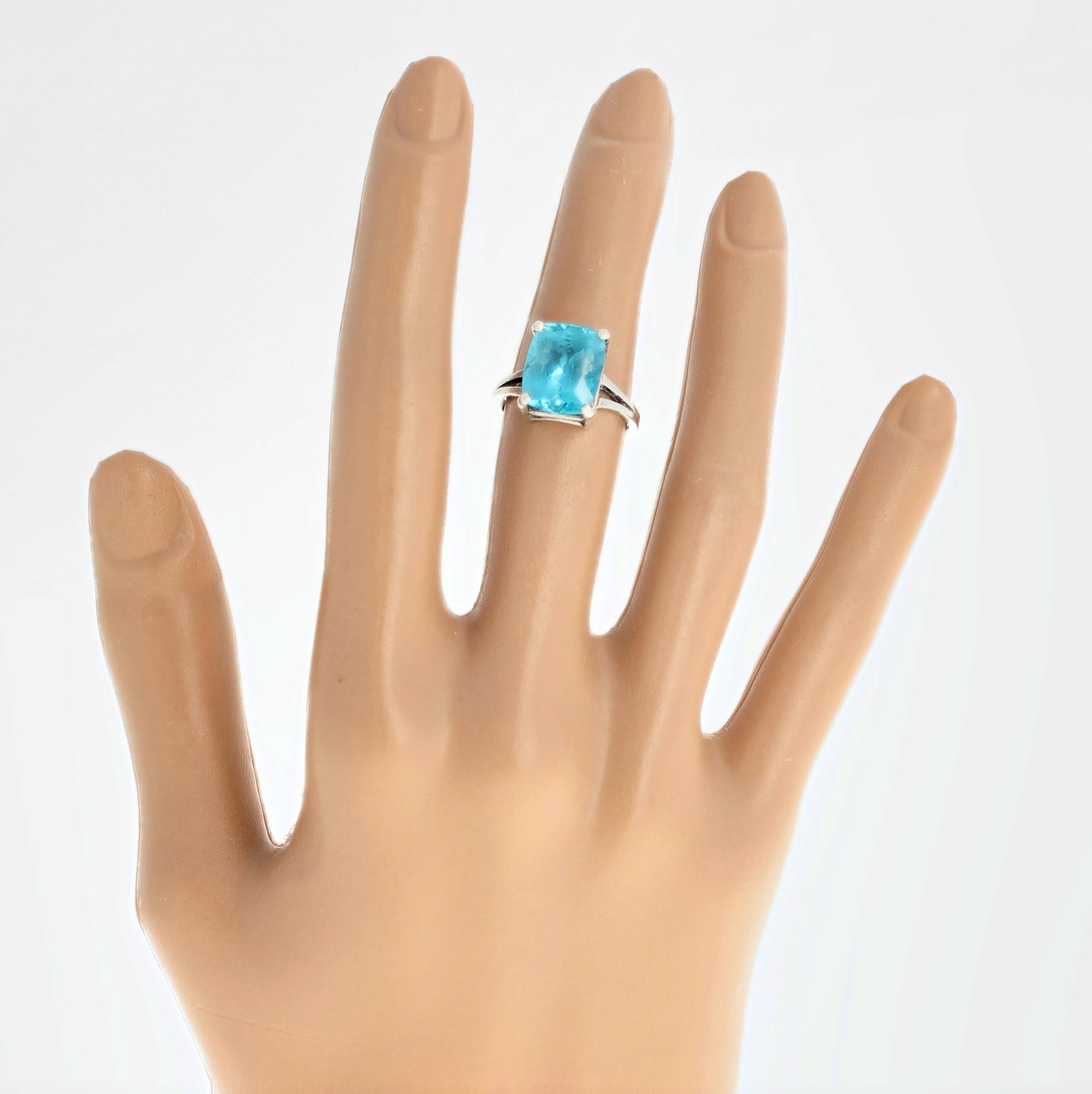 Gorgeous brilliant blue 5.4 carat Madagascar Apatite (12 mm x 10 mm) set in a sterling silver ring size 7 (sizable for free).  This is perfect for day or night.  
