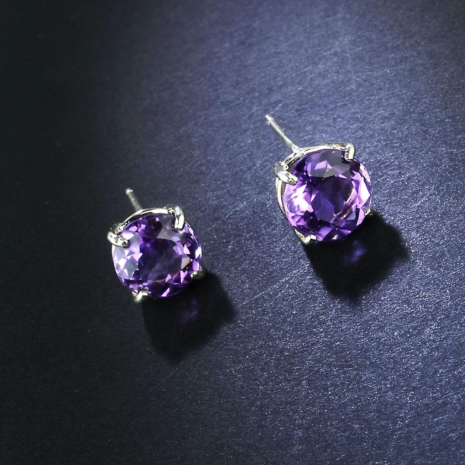 Bright and lively Round 9mm Amethyst Stud Earrings. These Amethysts are set in Sterling Silver baskets. Amethysts are perfect go everywhere earrings. Amethyst is the February birthstone.