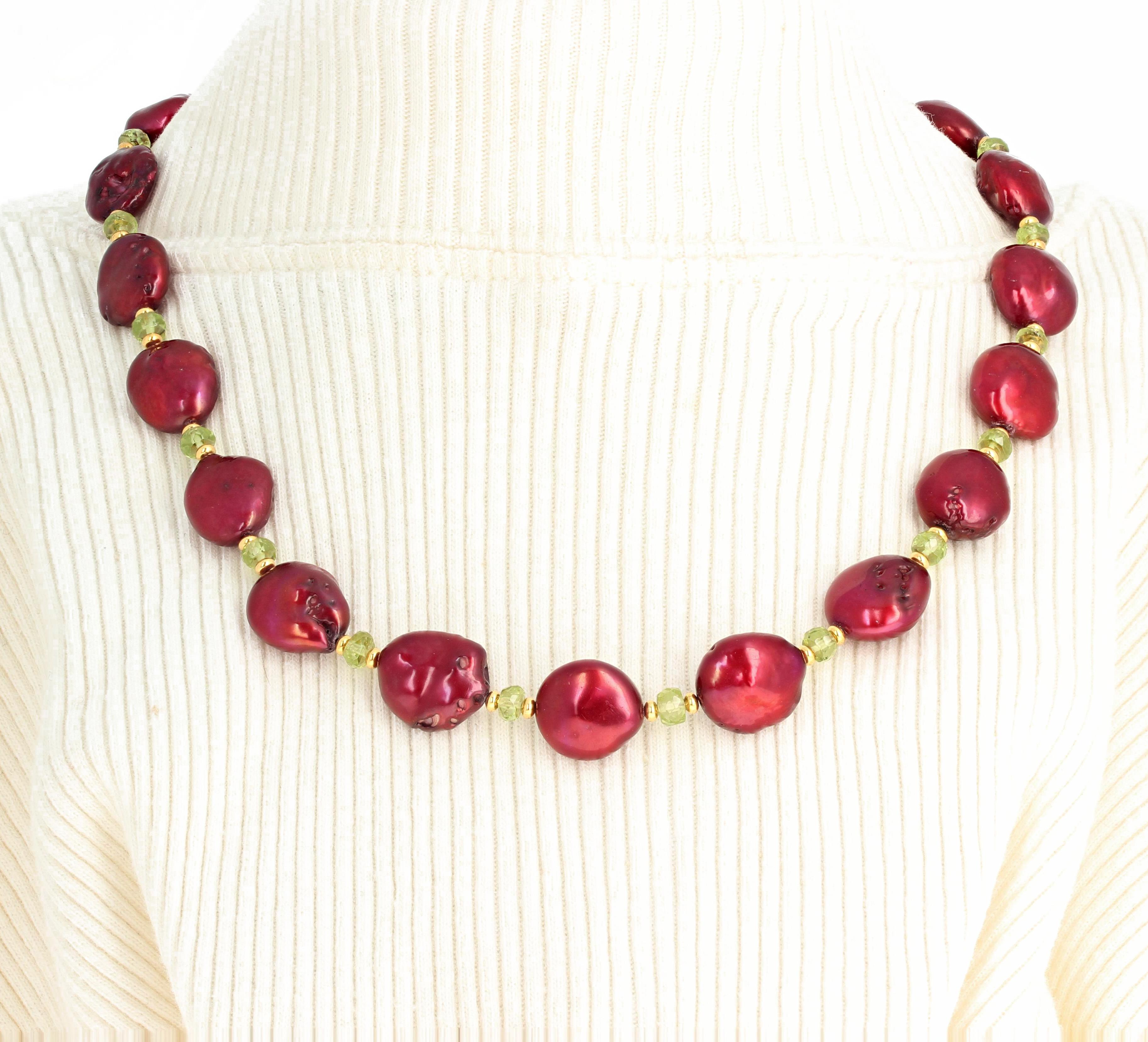 Brilliant wine red oval imperfect cultured Pearls enhanced with glowing checkerboard gem cut Peridot and little goldy color shining spacers.  This unique necklace is handmade and is 18 inches long with a gold tone toggle clasp.  