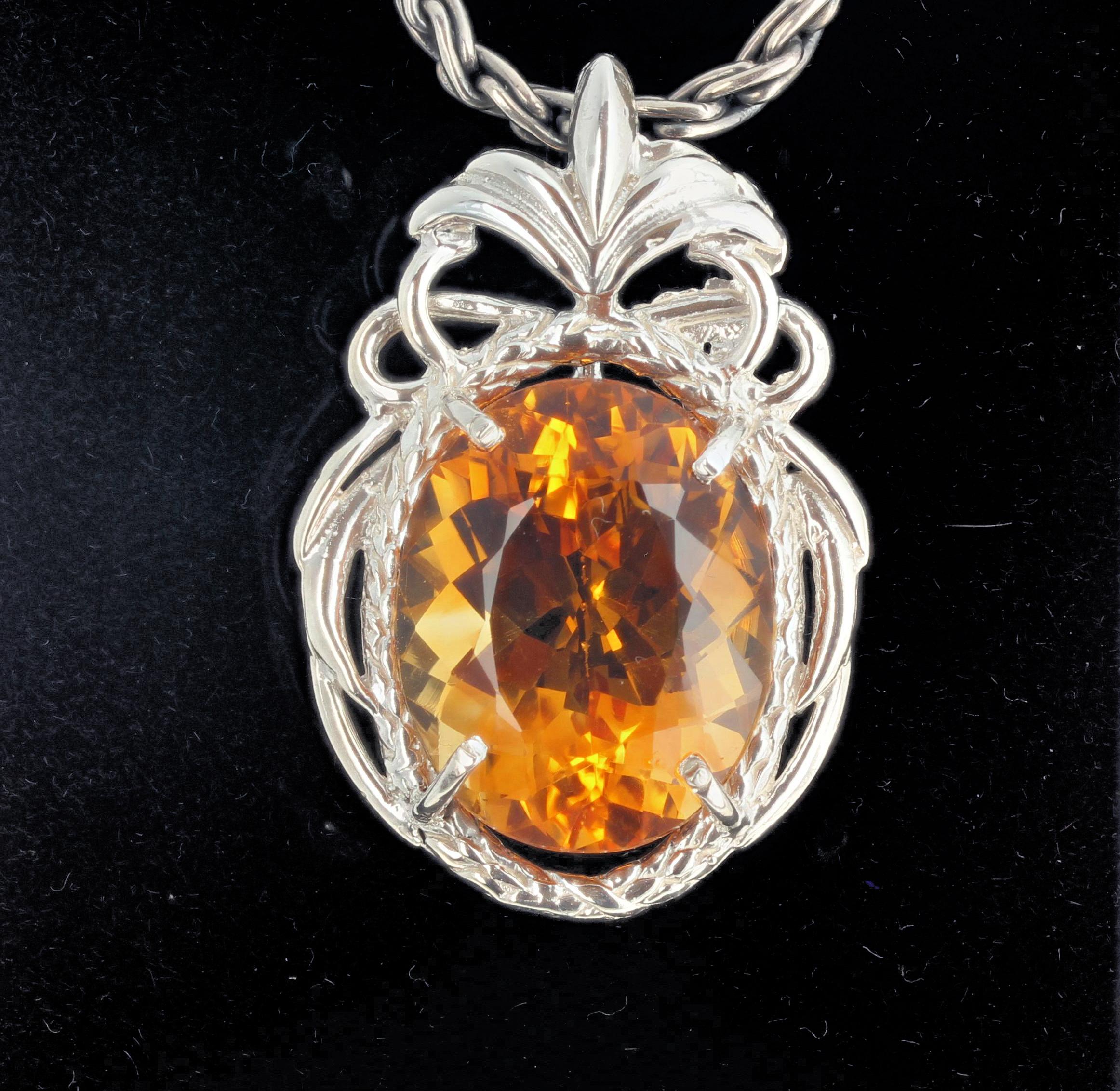 21 carat golden glittering natural Citrine (20 mm x 16.2 mm) set in a lovely unique handmade sterling silver pendant.  There are no eye visible inclusions in this gorgeous gemstone.   