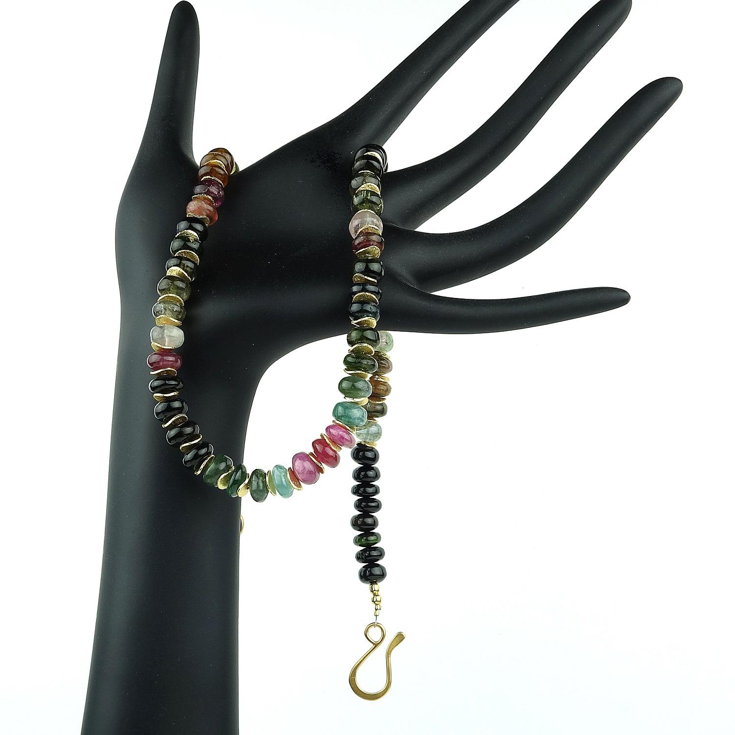 Custom made, multi color highly polished Tourmaline rondel necklace.  The colors of these gorgeous Tourmalines are highlighted with flirty, fluttery gold tone accents.  The 19.5 inch necklace length is perfect for sitting on your collar bone.  These