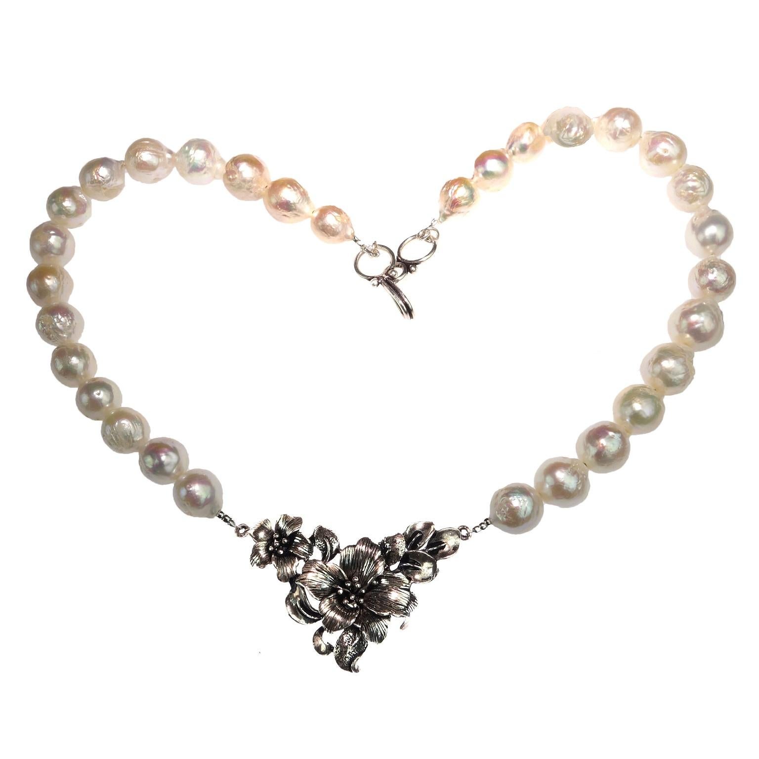 Captivating, custom made pearl necklace with Floral Sterling Silver focal. You will love this unique 16 inch necklace with a lovely 1.5x1 inch focal sitting just at the base of your neck. The glowing white wrinkle pearls enhance all skin tones.