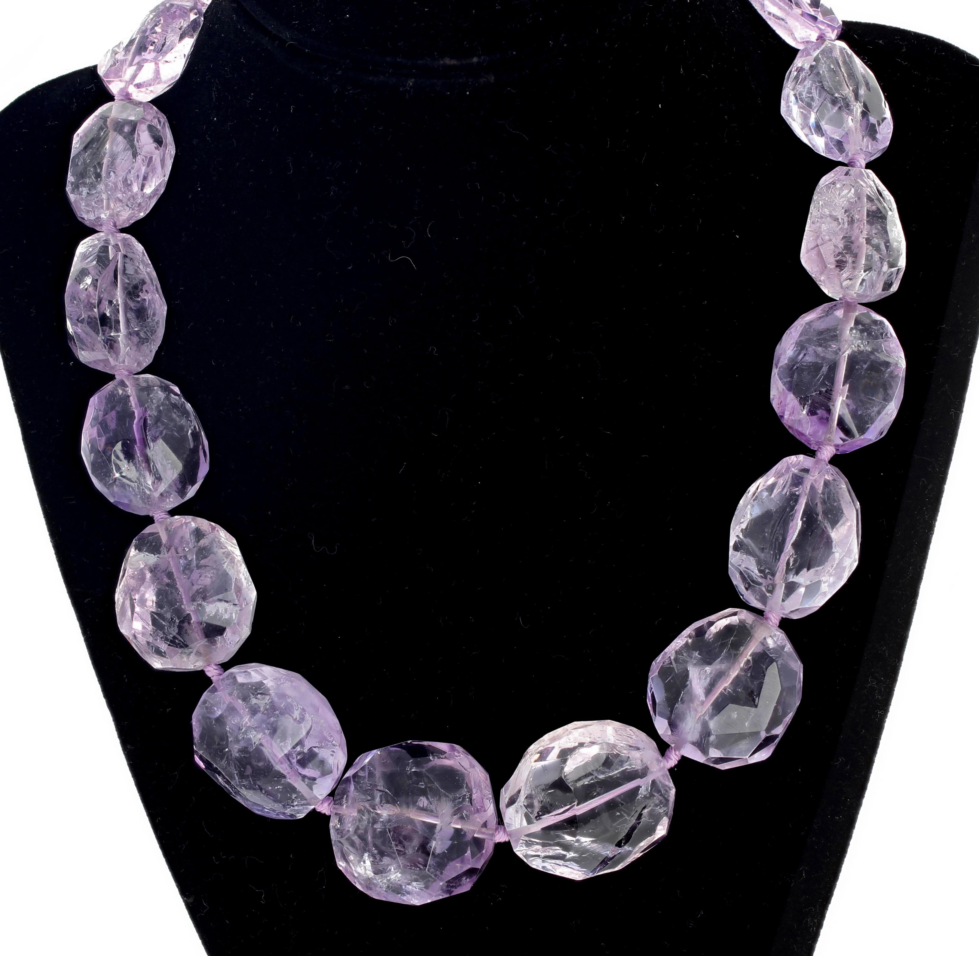 Glittering highly polished Rose of France Amethyst gemstones rocks compose this gorgeous pinkypurple 18.5 inch long handmade necklace.  The largest gemstone is approximately 28mm x 26 mm. 
