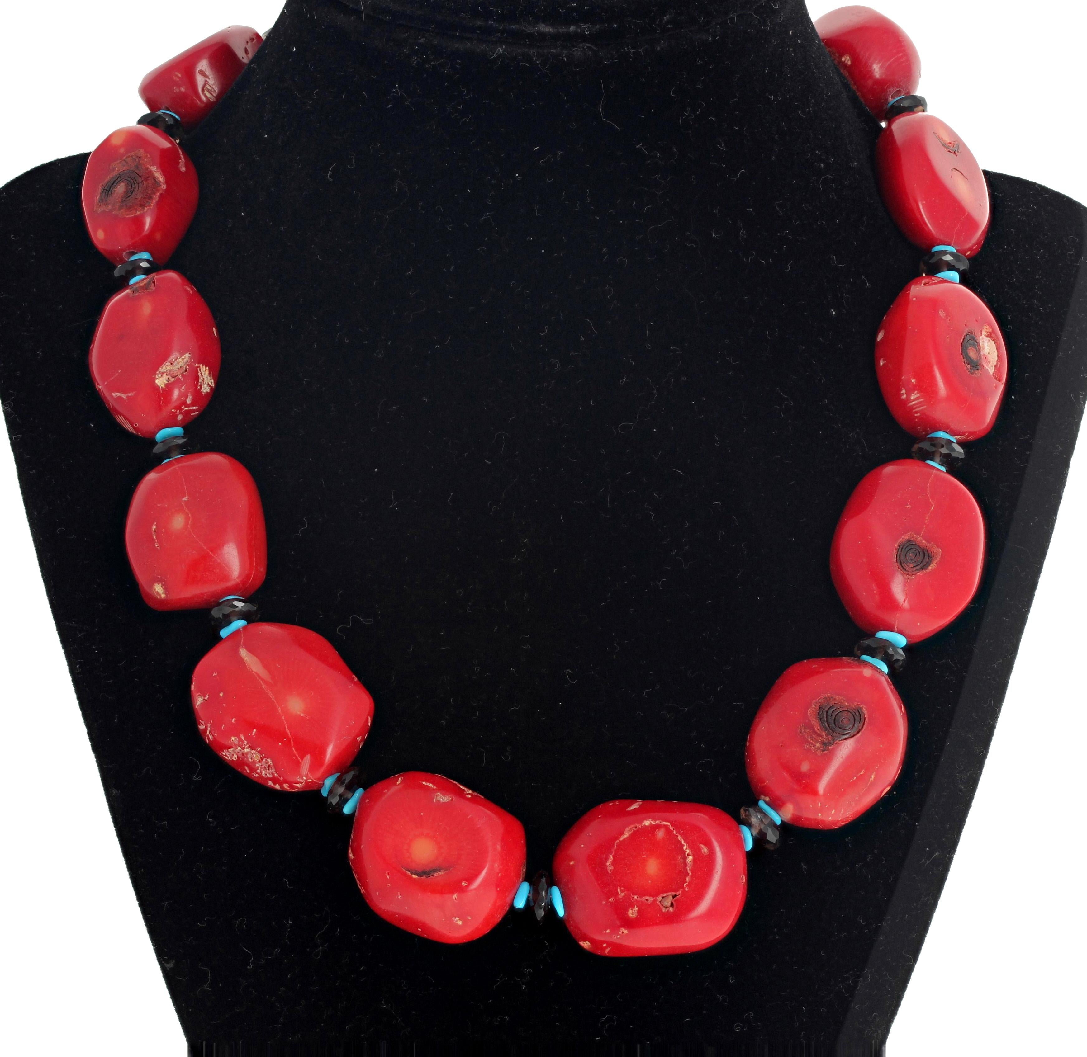Dramatic chunky polished red Bamboo Coral 18 inch long necklace enhanced with Smoky Quartz and blue Turquoise ringlets.  This is 18 inches long with silver clasp.  Largest Coral is approximately 25 mm x 20 mm.   This is artistically magnificent.