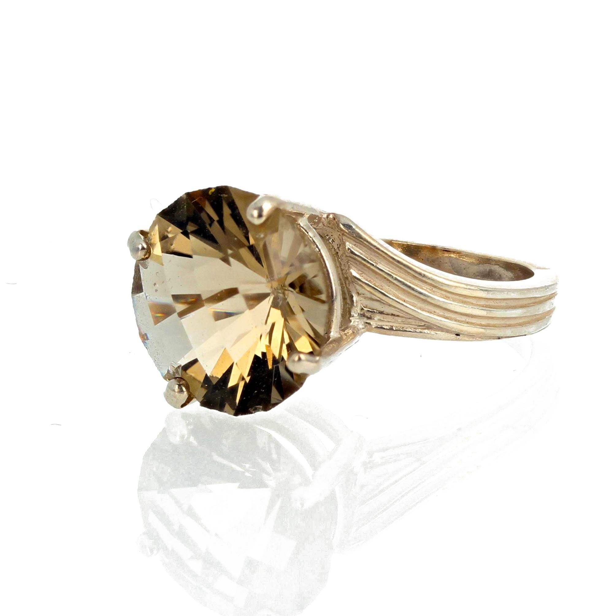 This yellow/goldy 4 carat Labradorite (12 mm) is cut to glow like a large champagne diamond.  It is a size 7 (sizable) set in a sterling silver ring.  