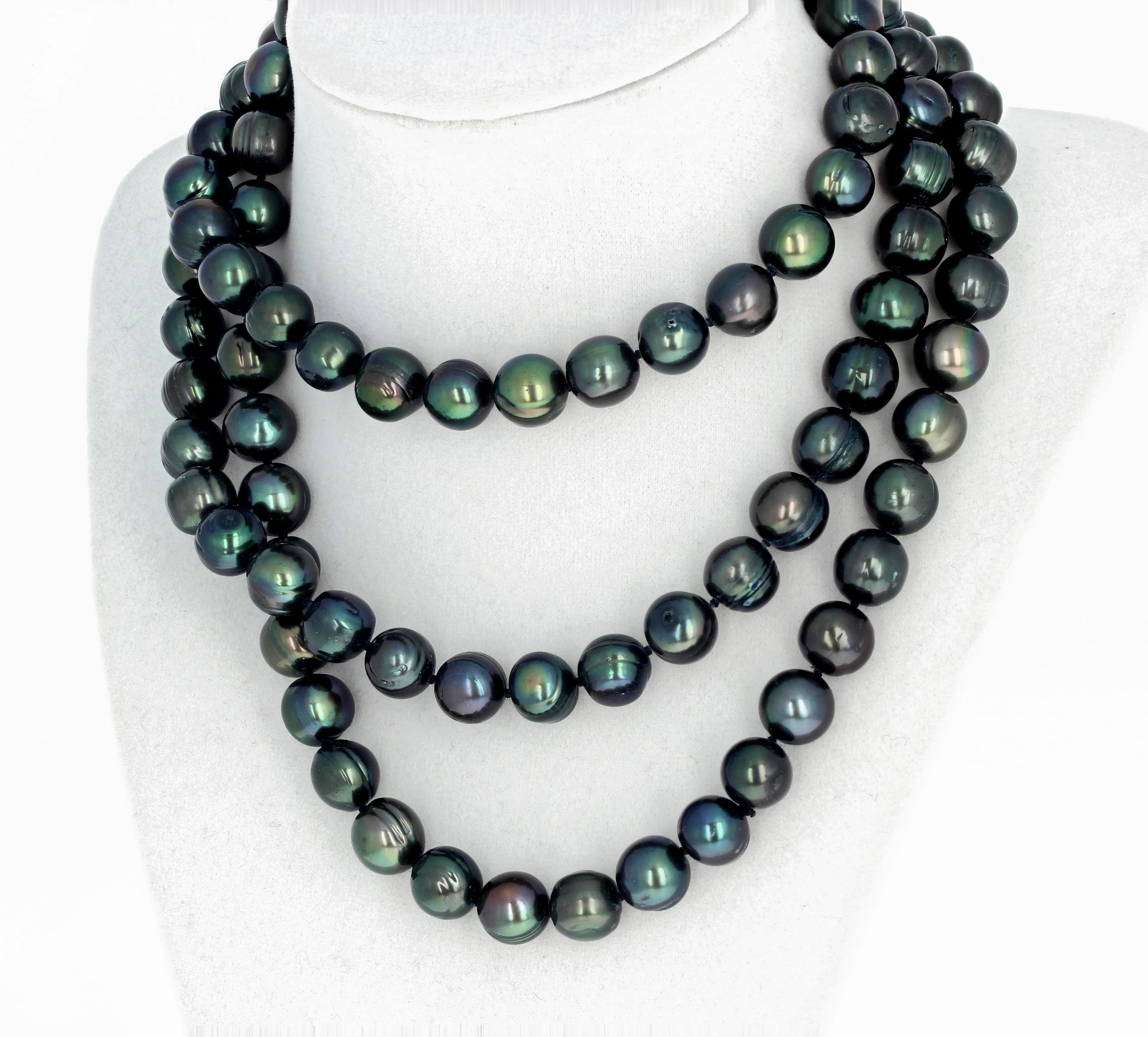 Glowing brilliant Fireball type freshwater endless cultured Pearls with a slightly greenish tone 48 inches long and measure approximately 10.5 to 11 mm round.  This is a continuous necklace with no clasp so you can swing it around your neck several