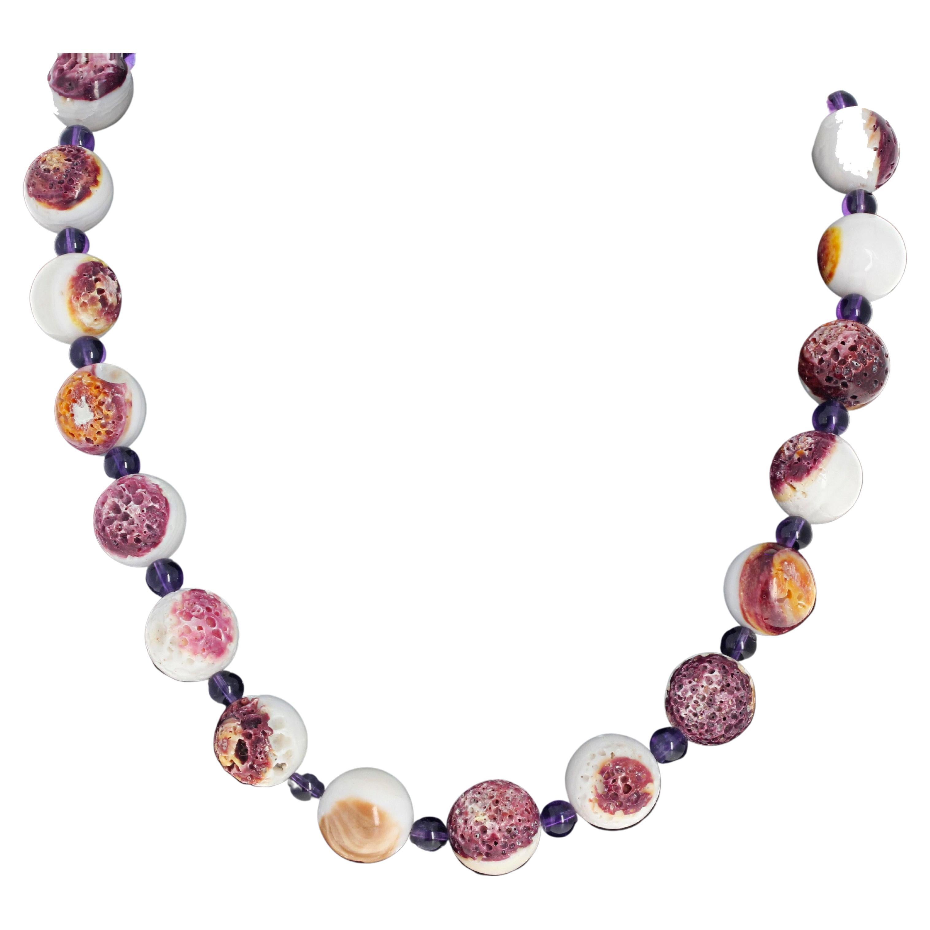 This amazing real Spiny Oyster ( 16 mm) is enhanced with glowing highly polished round real Amethysts gems ( 6.5mm).  The necklace is 20 inches long and has an easy-to-use silver plated hook clasp.  This is really beautiful and amazingly