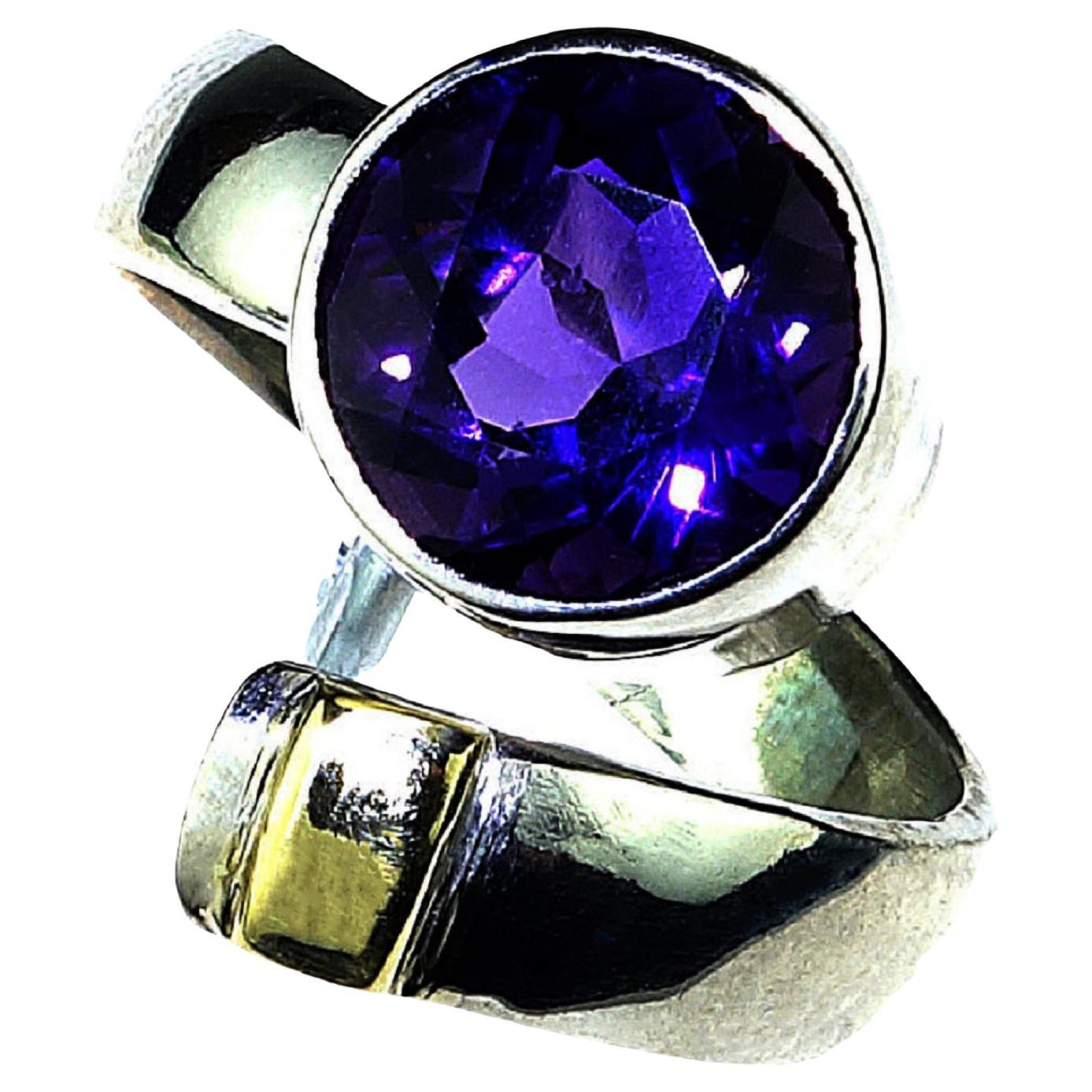 Handmade Sterling Silver and Amethyst Ring. Pinky finger delight! This lovely ring caresses your pinky with its deep purple, round amethyst focal point bezel set in sterling silver to the tip of 14K yellow gold to enhance the purple.  It was
