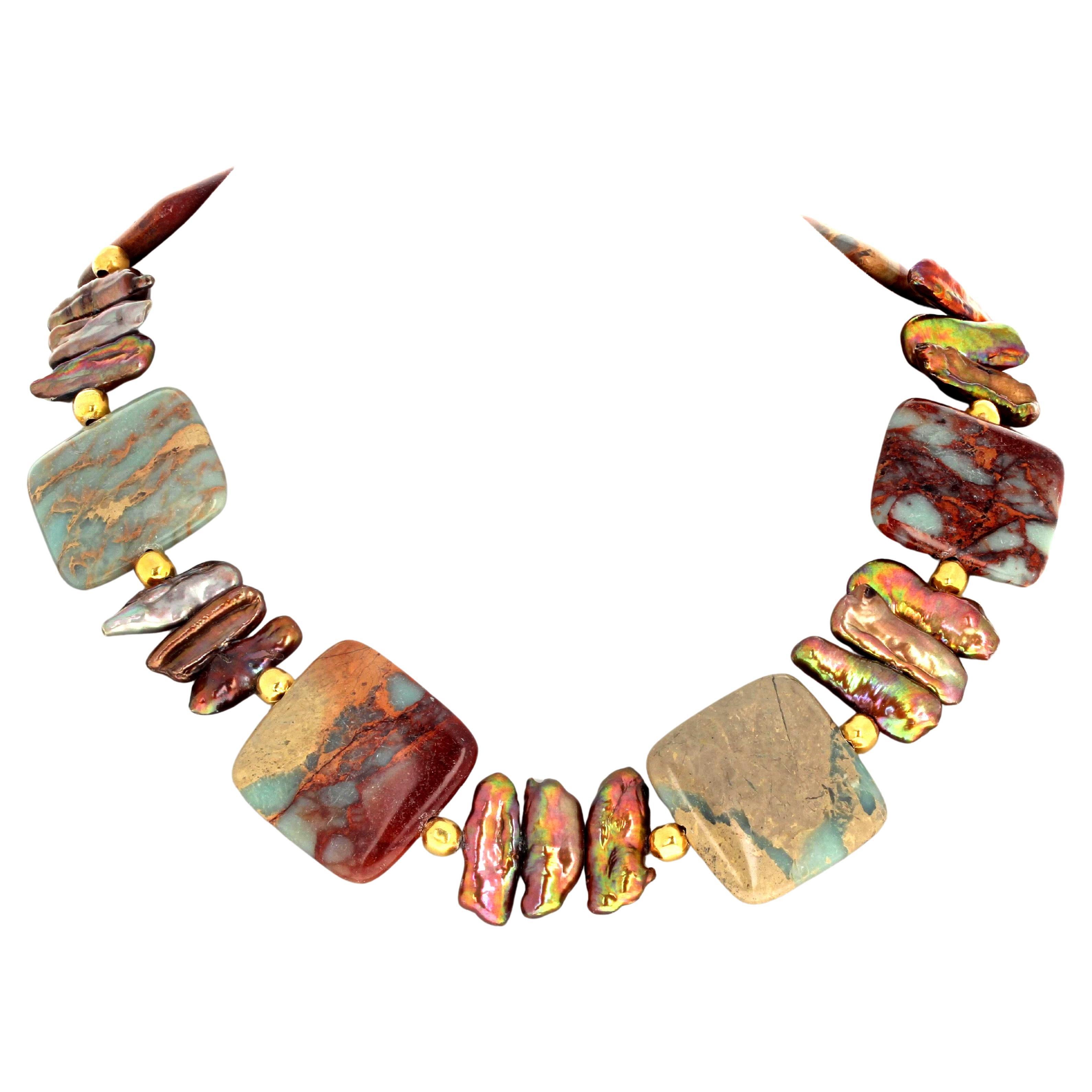 This beautiful 18 inch long natural Serpentine necklace is enhanced with glittering natural real Pearls.  The largest Peals are approximately 24mm x 10mm and the gold plated enhancements are 6mm.  The clasp is an easy to use gold plated hook clasp.  