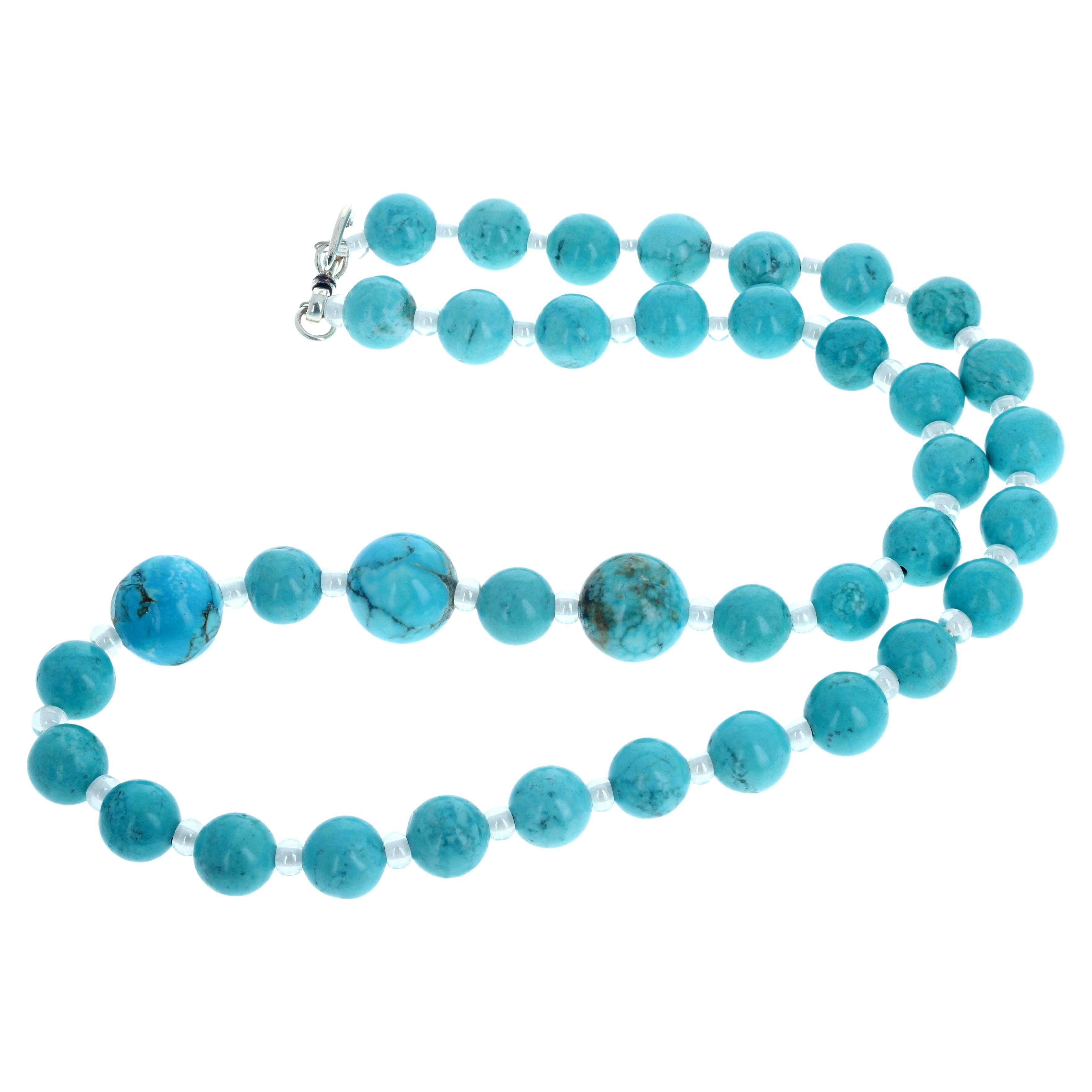 This lovely exquisite elegantly glamorous natural Blue Magnesite highly polished necklace is 20 1/2 inches long and set dramatically.  The three largest Magnesites are approximately 14mm.  The sparkling little enhancers are silvery chrystally