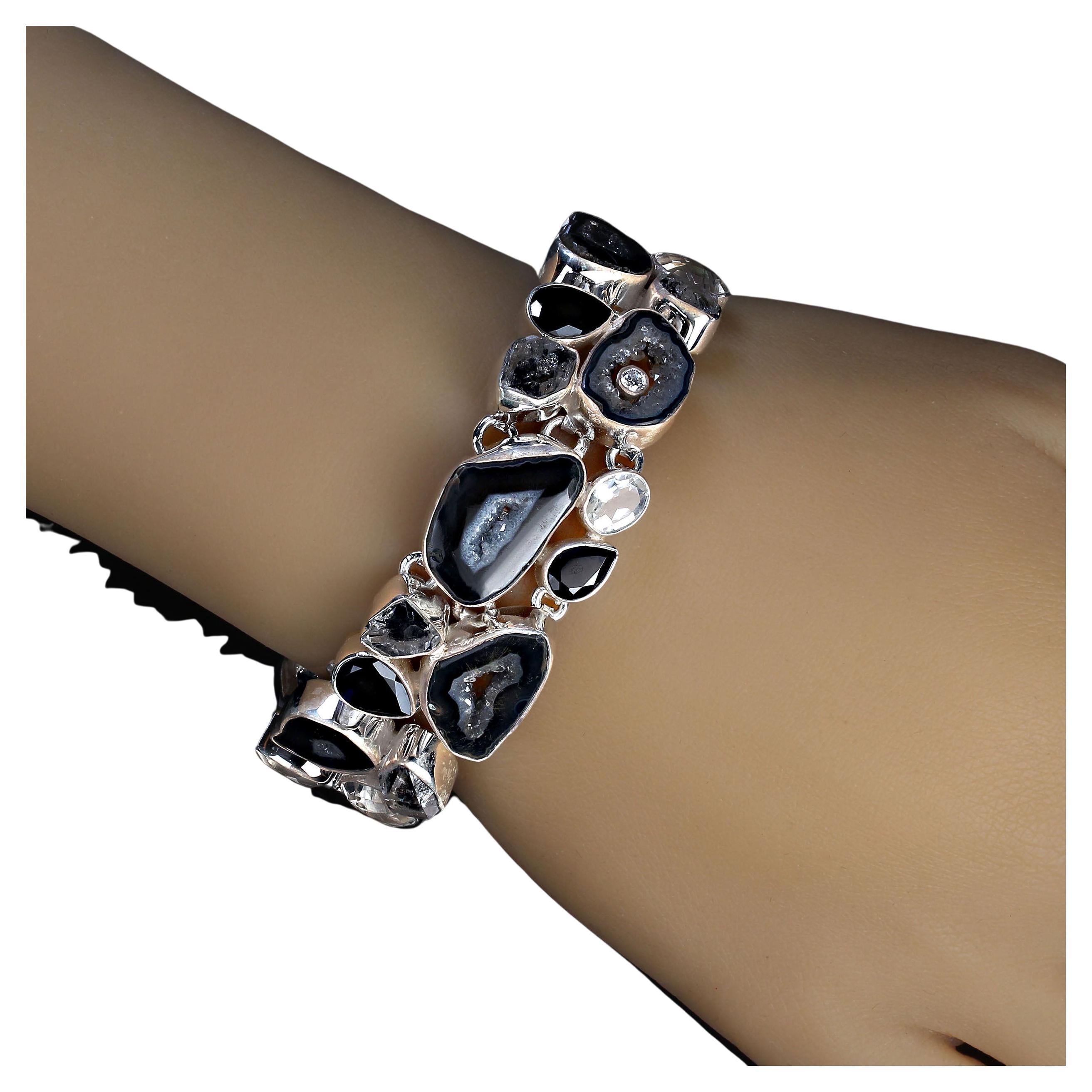 Elegant black agate and white quartz crystal in silver bracelet.  This striking bracelet is just what you need for all you black and white ensembles. The bracelet is almost an inch wide and 6.5 inches up to 8 inches in length. The bezel set