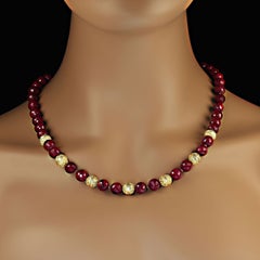 AJD Elegant faceted Ruby beaded necklace with goldy accents 21 Inches.
