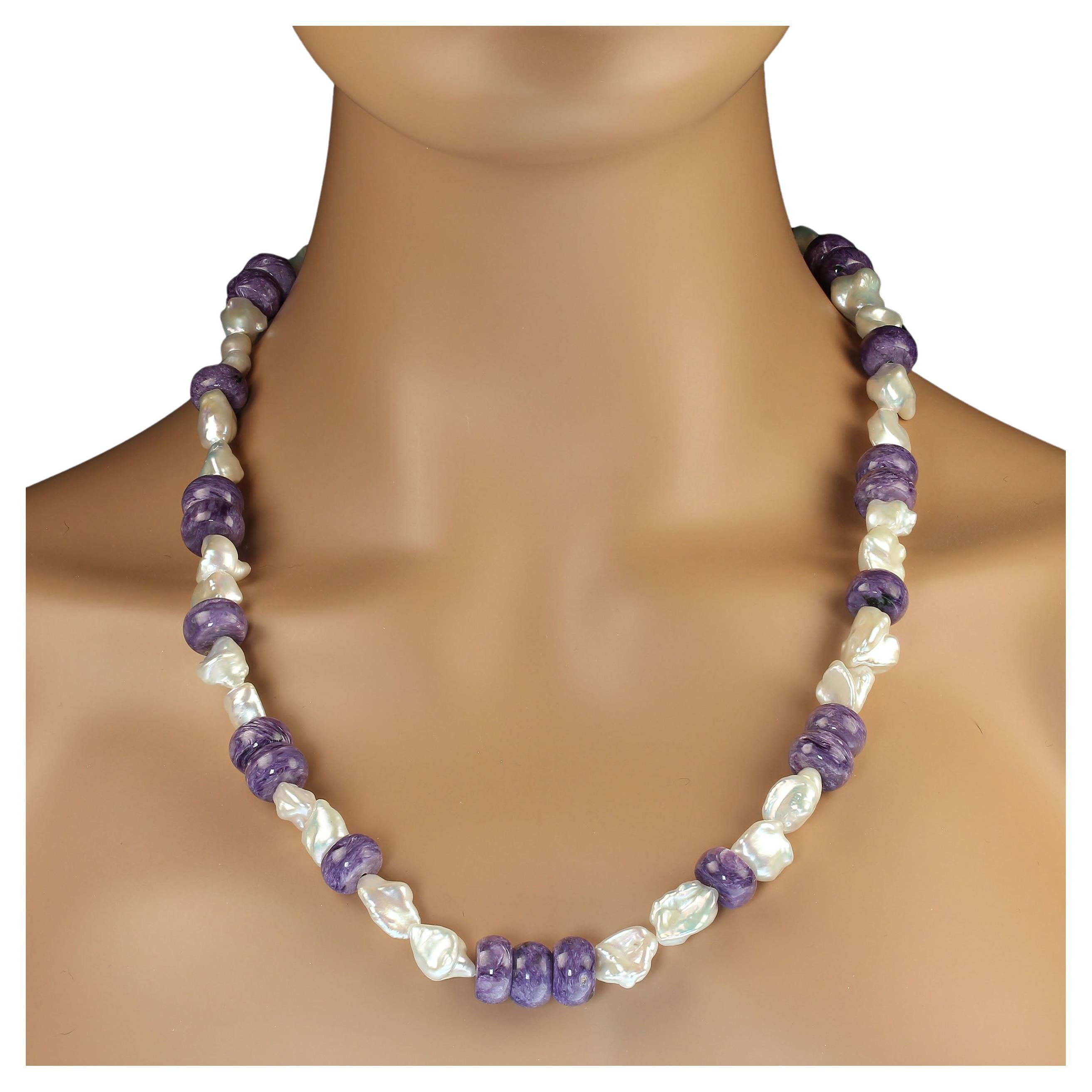 24-25 Inch Expandable necklace of creamy white freshwater pearls of interesting shapes and smooth purple Charoite rondelles.  These iridescent pearls juxtapose with the purple Charoite for an elegant fresh look in a pearl necklace. Wear this