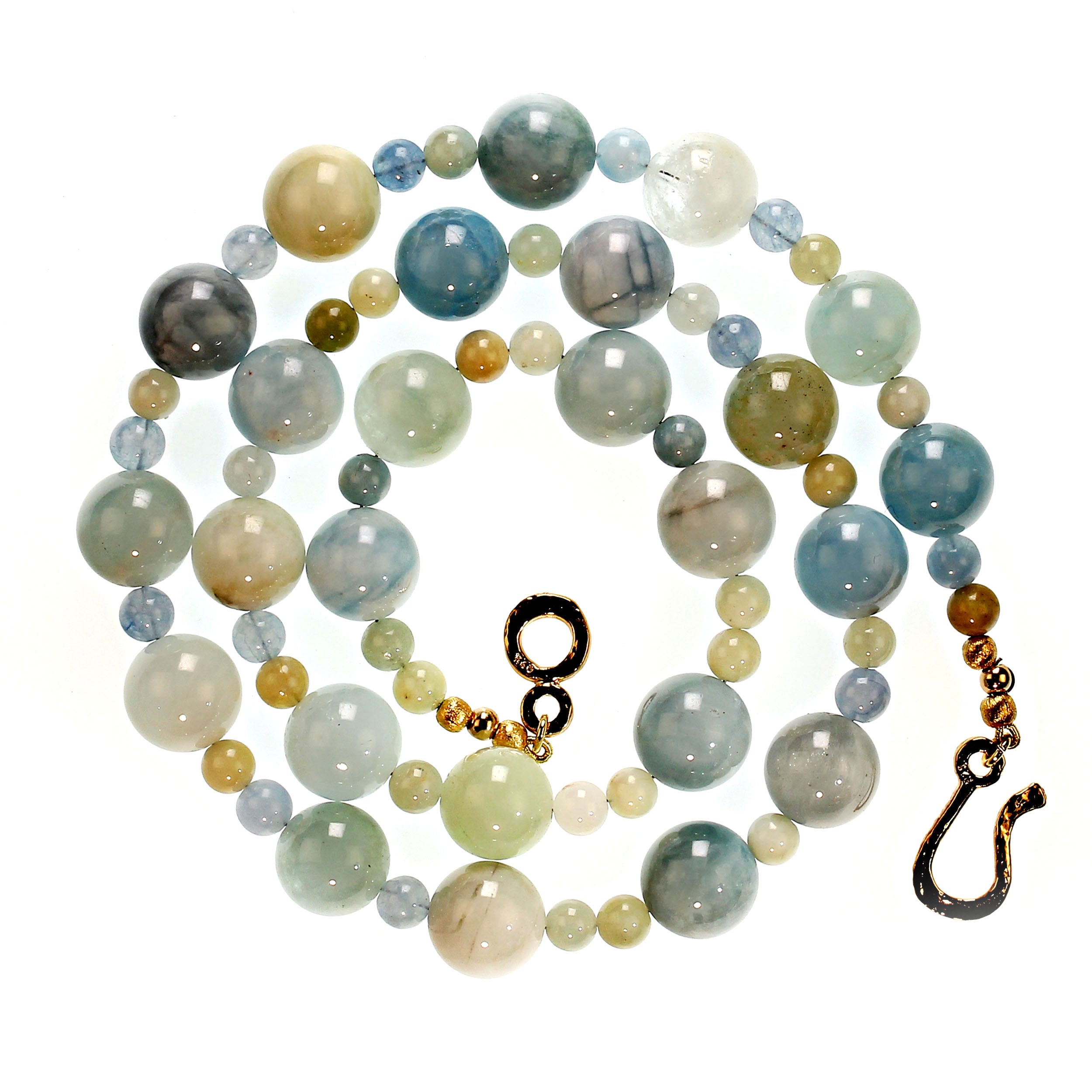 Striking necklace of two sizes of Aquamarine-Beryl,14 and 8 MM, mix blue, green, and cream colors of Aquamarine and Beryl. This 26-inch necklace is secured with a hammered 14K vermeil hook and eye clasp.  MN2338