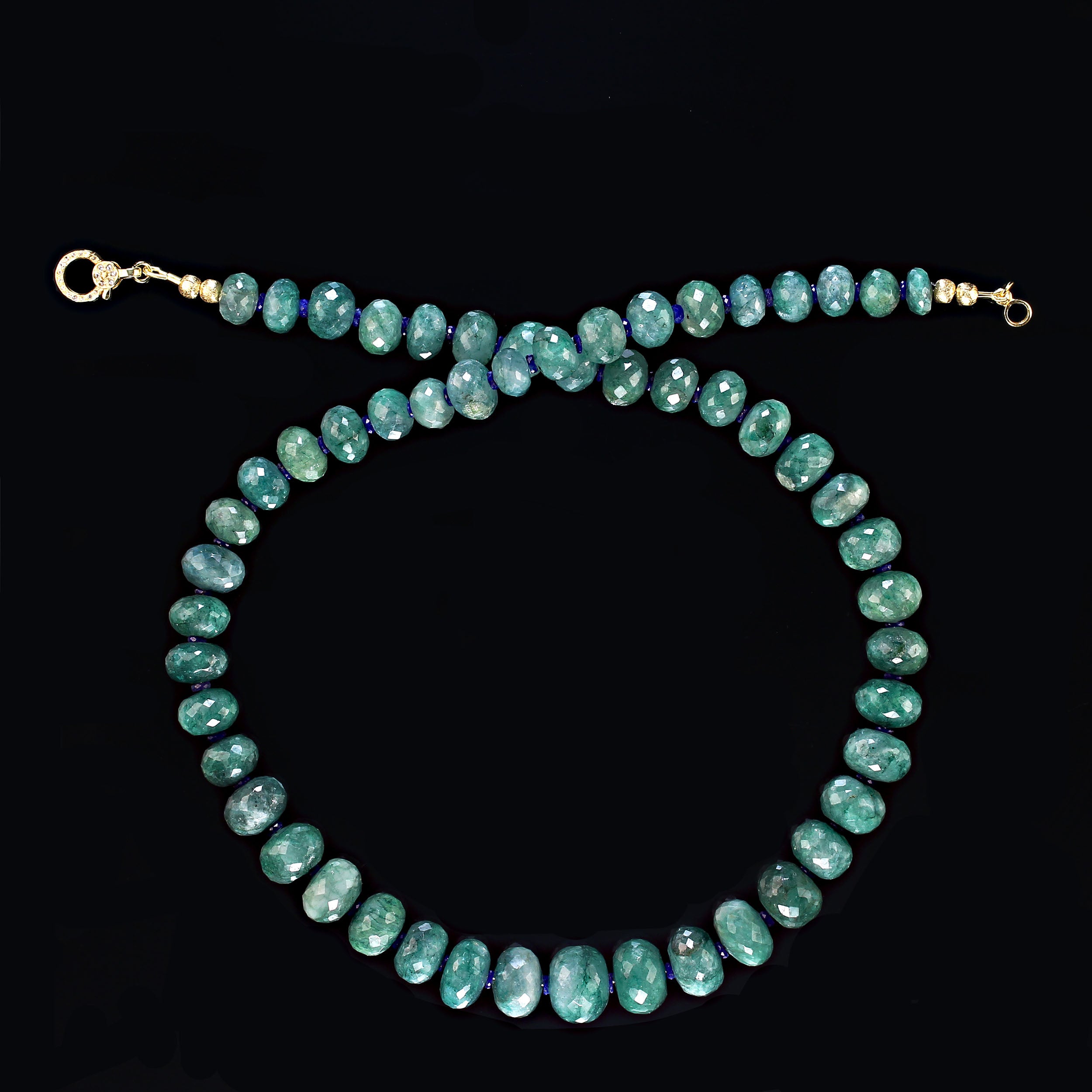 21 Inch sparkling green Green Beryl/Emerald necklace. Green enhances everything and this necklace proves that point.  The facets sparkle and pop as the necklace moves.  The rounded rondelles graduate 8-13MM and are accented with sparkling 3MM blue
