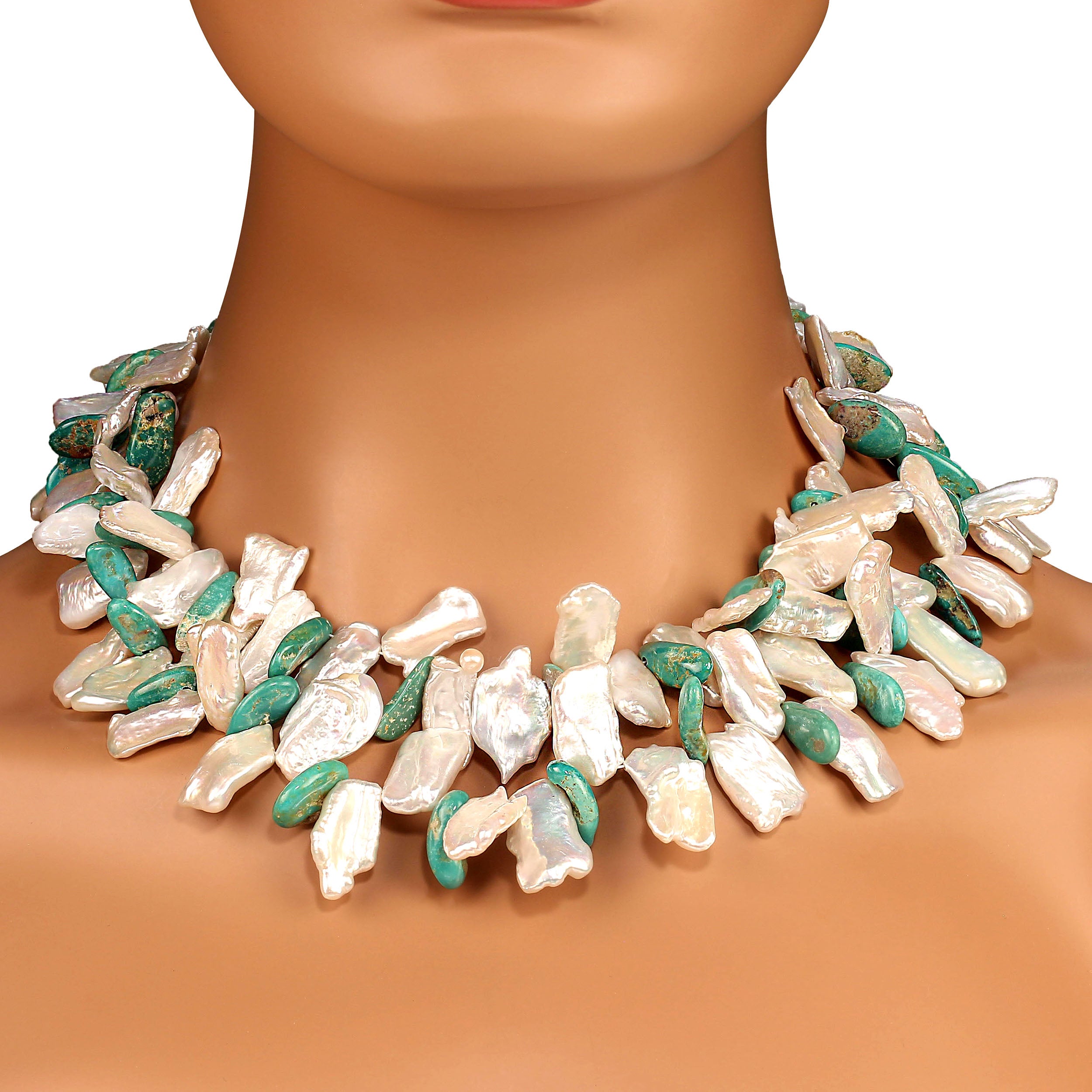 Unique 38-inch necklace of Elisa turquoise dangles and white flat keshi pearls.  These iridescent keshi pearls reflect the light and turquoise color.  The necklace is secured with a detailed pewter toggle clasp.  At 38 inches this necklace can be