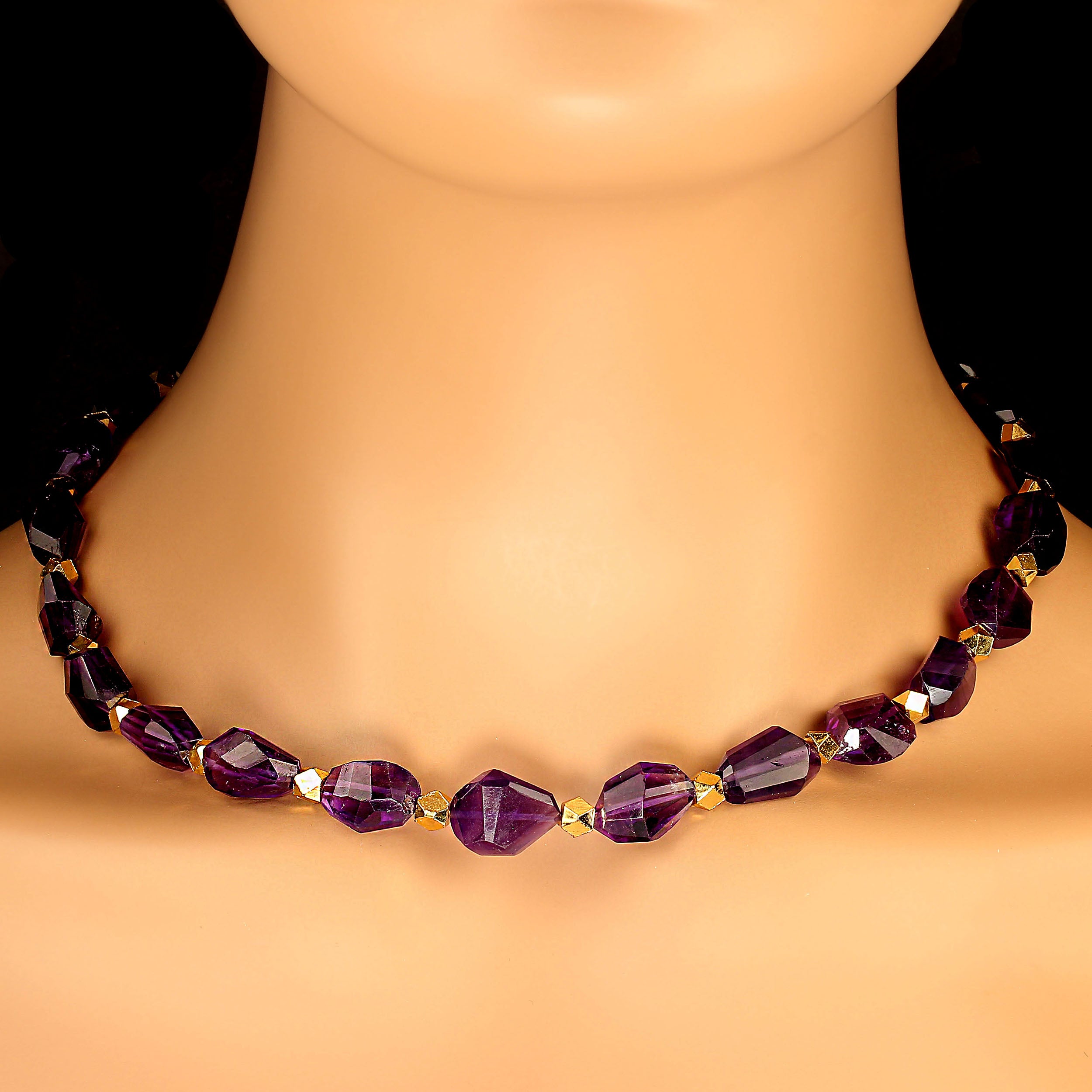Gorgeous, purple glowing amethyst polished chunks necklace with goldy accents.  Each of these polished chunks is a unique size and shape.  The necklace is secured by a two-ring gold plated toggle clasp. MN2406