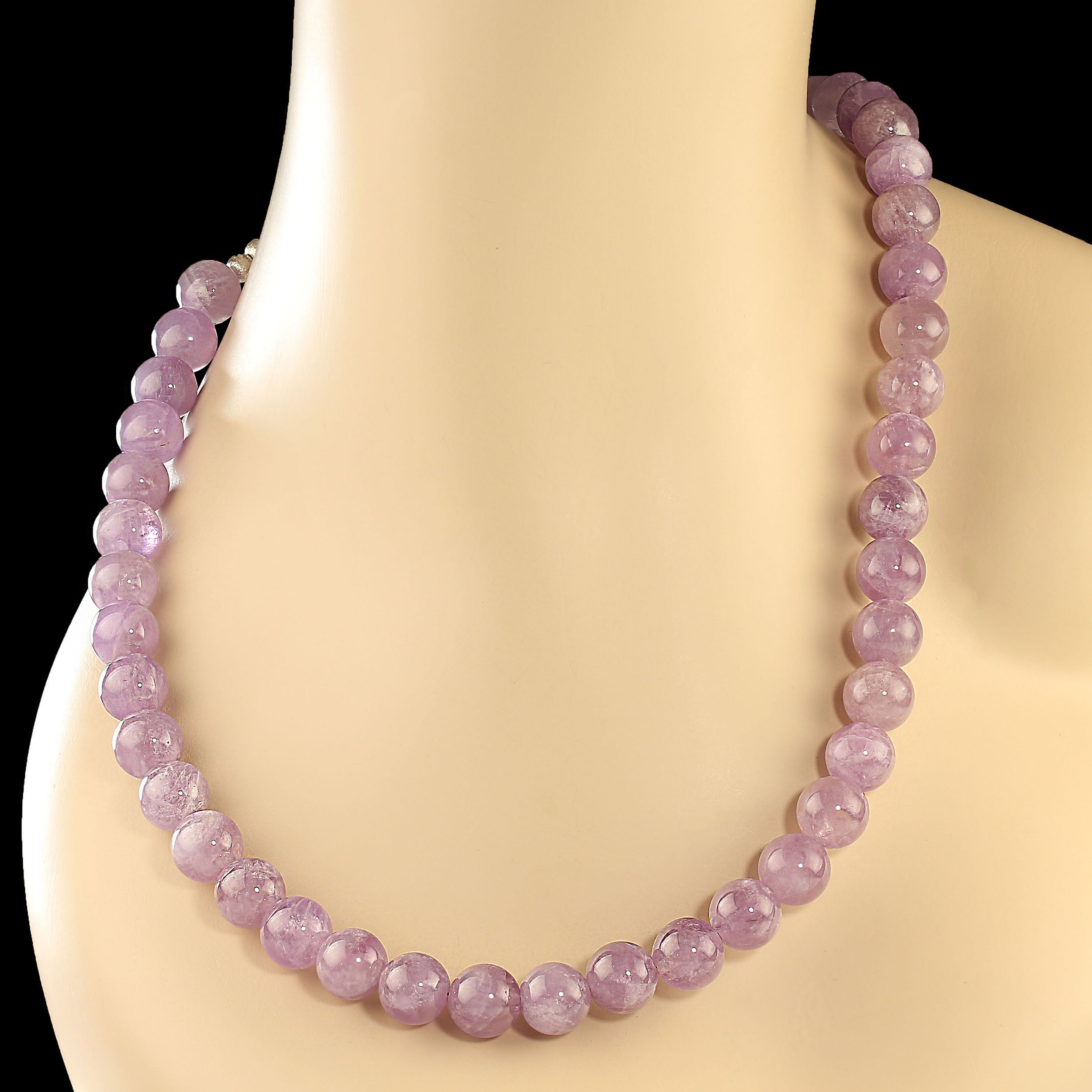 February Birthstone!  What a great gift for the February Baby.  This 25-inch necklace is glowing translucent lilac amethyst.  The necklace is smooth highly polished 12 mm beads. It is secured with a silver plate easy to use 'S' hook.  MN 2408