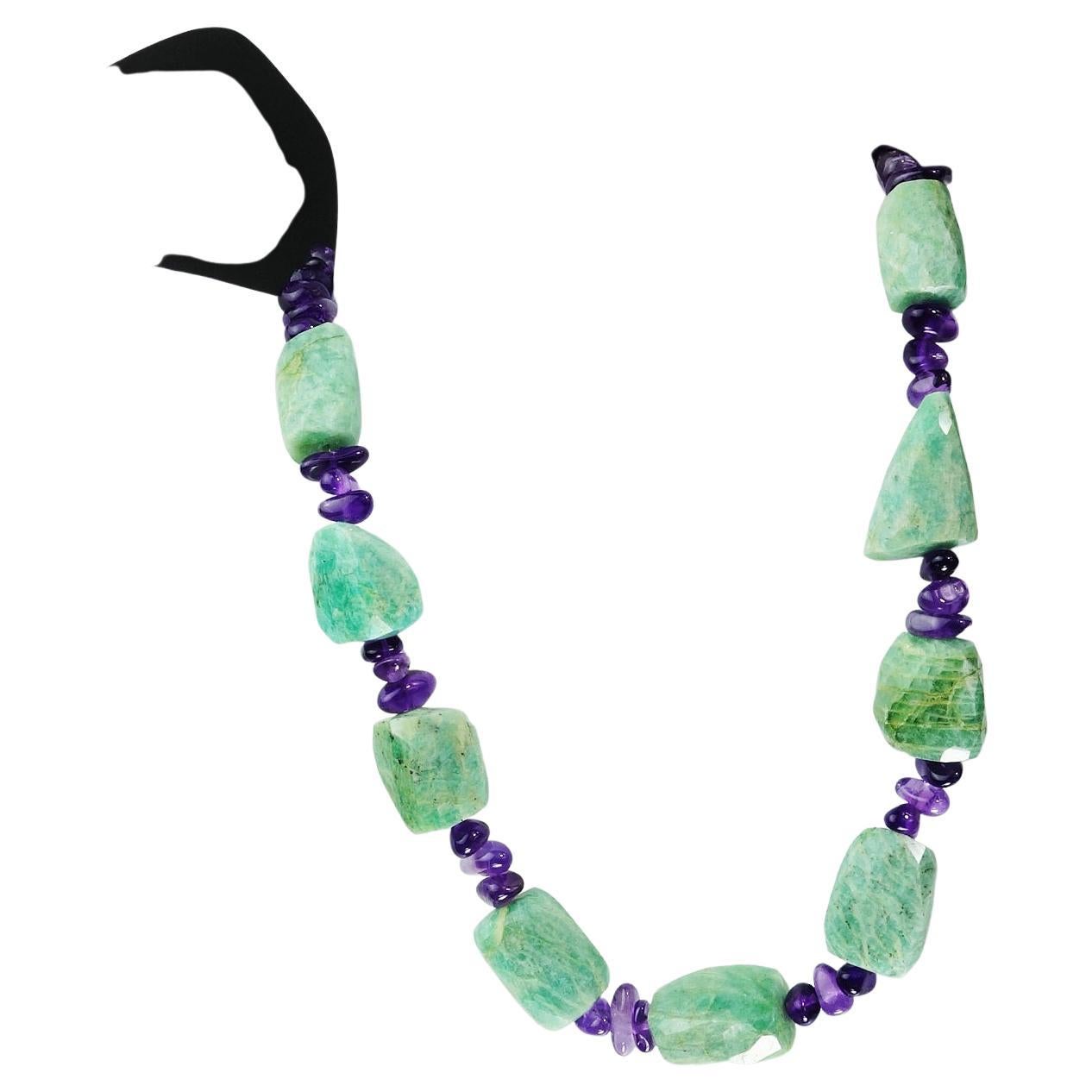 Interesting chunks of green Amazonite separated and set off with tumbled and highly polished Amethyst. The combination of soft green and bright purple is unbeatable. The necklace is 17 inches and secured with a silver tone toggle. Amethyst is the