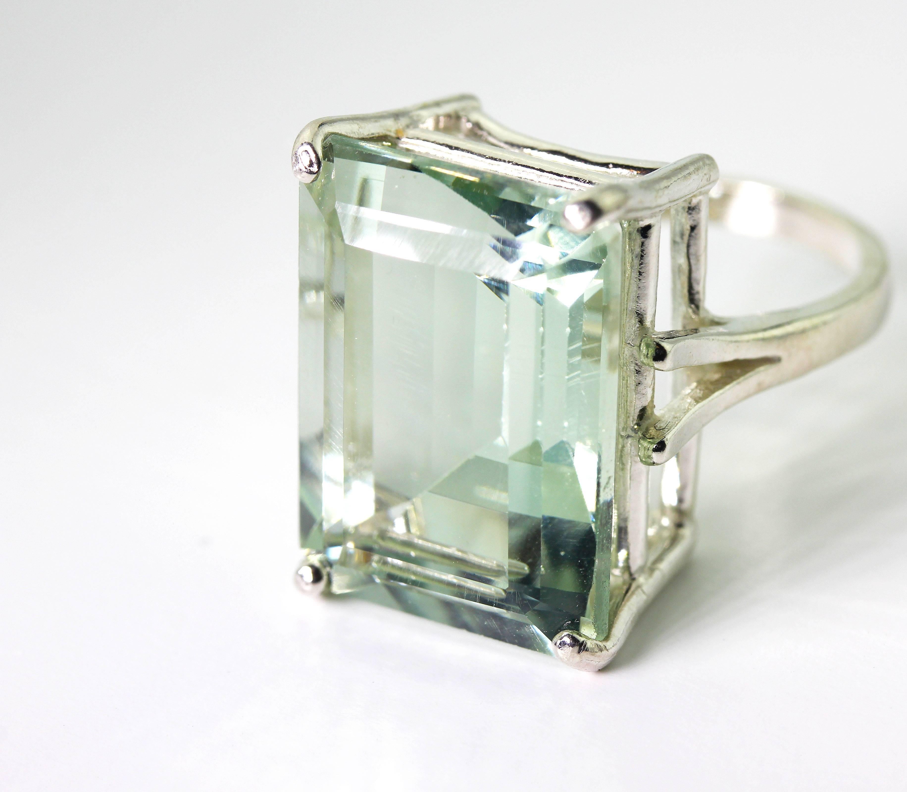 This clean huge beautiful brilliant 23.95 carat Prasiolite is set in sterling silver ring and is really visually flawless. The ring is a size 7 (sizable). 