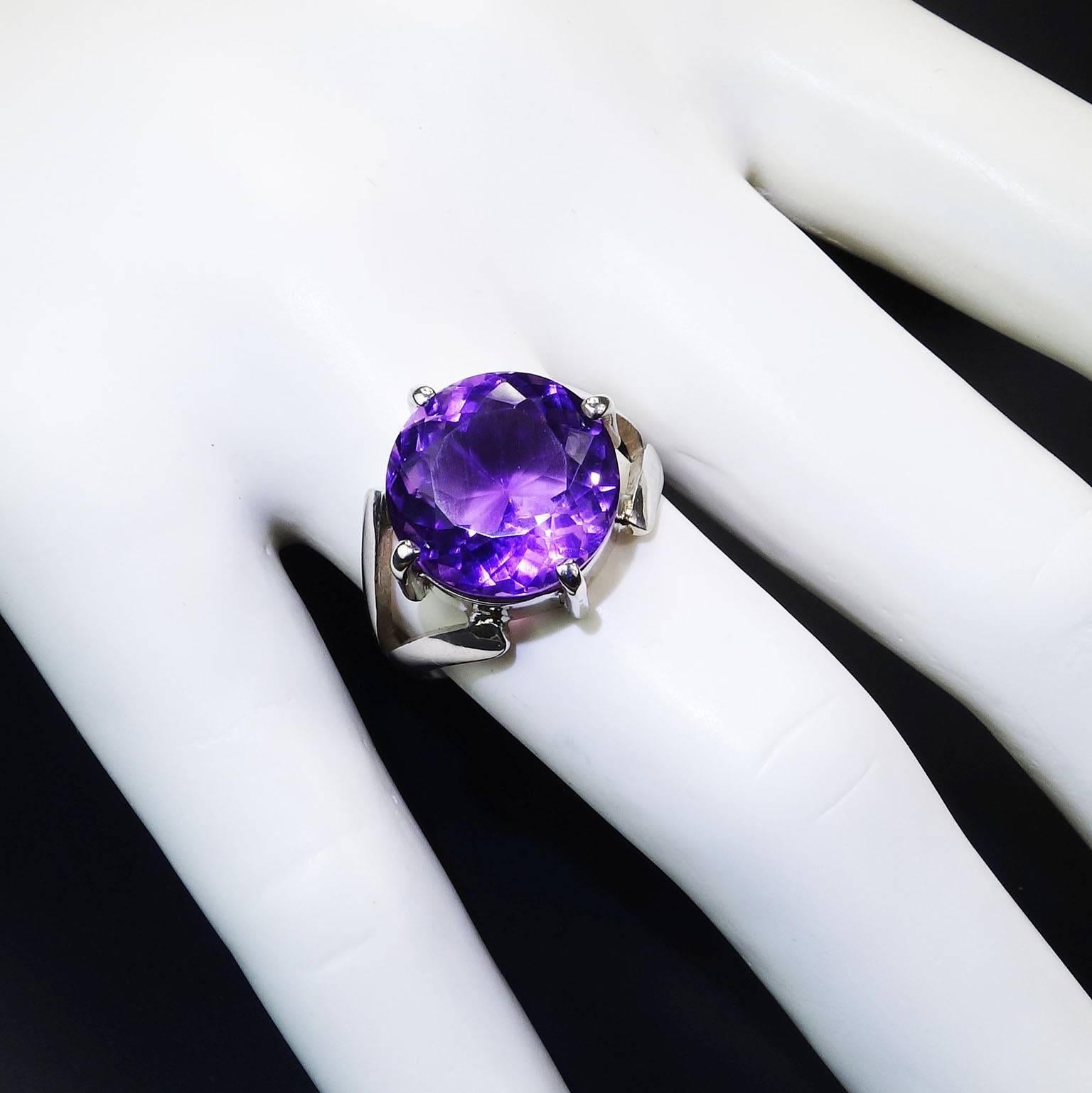 For the amethyst lover! February's birthstone. This custom made, round Brazilian Amethyst (13mm) has flashes of pink. The sterling silver setting perfectly complements the unique gemstone and was designed and created in our studio in the mountains
