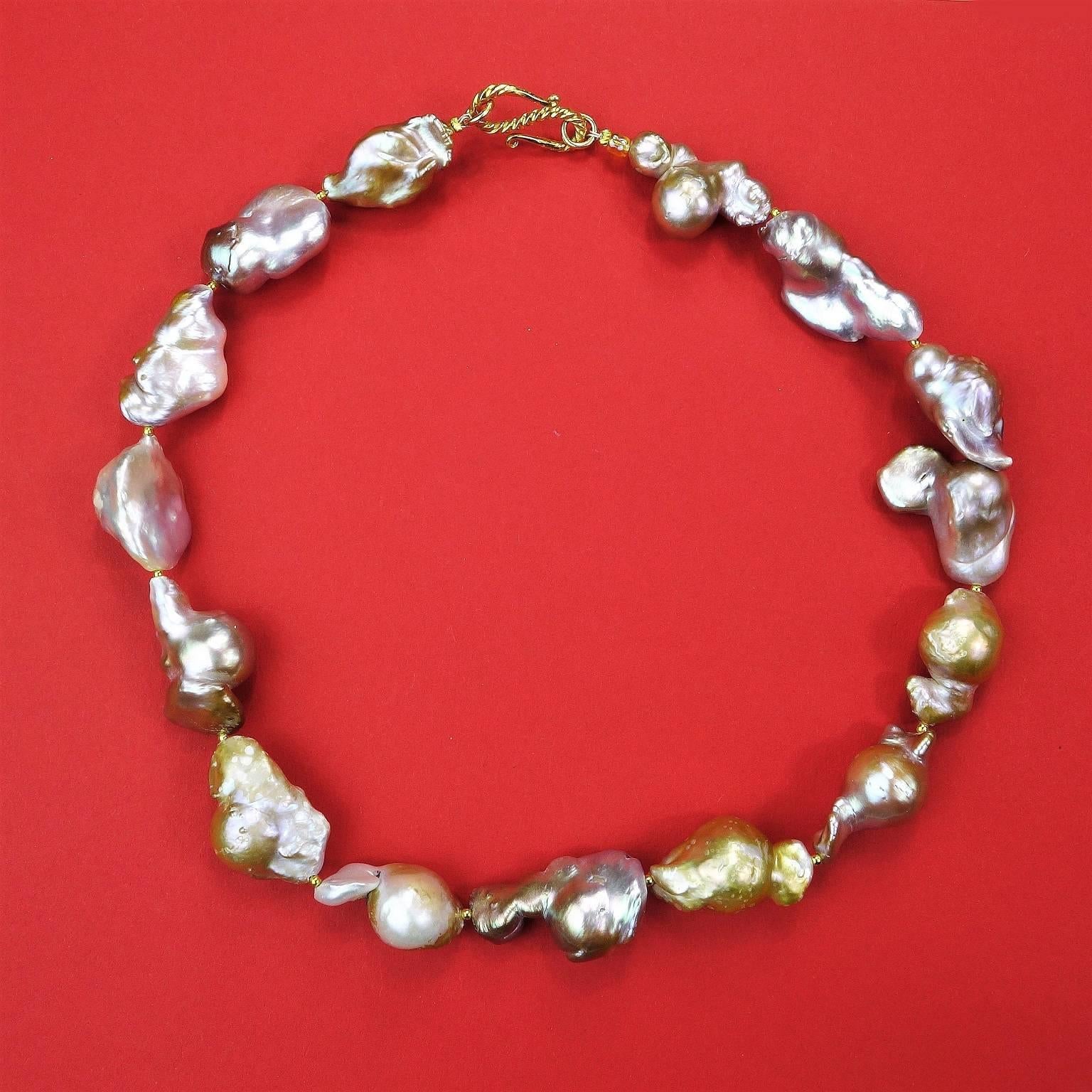 Silvery-Gold tone Iridescent Large Baroque Pearl Necklace. These gorgeous freeform Baroque Pearls flash pink and yellow in addition to the basic tones of silver, gold, gray, and mauve.  They are each very individual shapes which create a unique 18